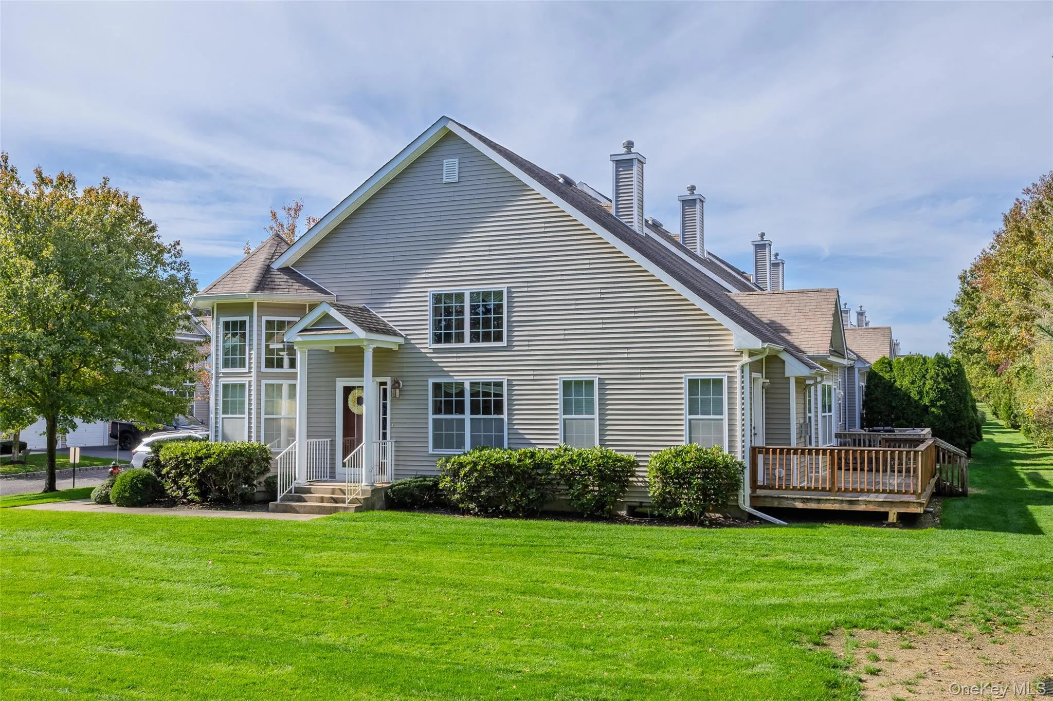 Rear view of property featuring a chimney and a lawn Rear view of property featuring a chimney and a lawn