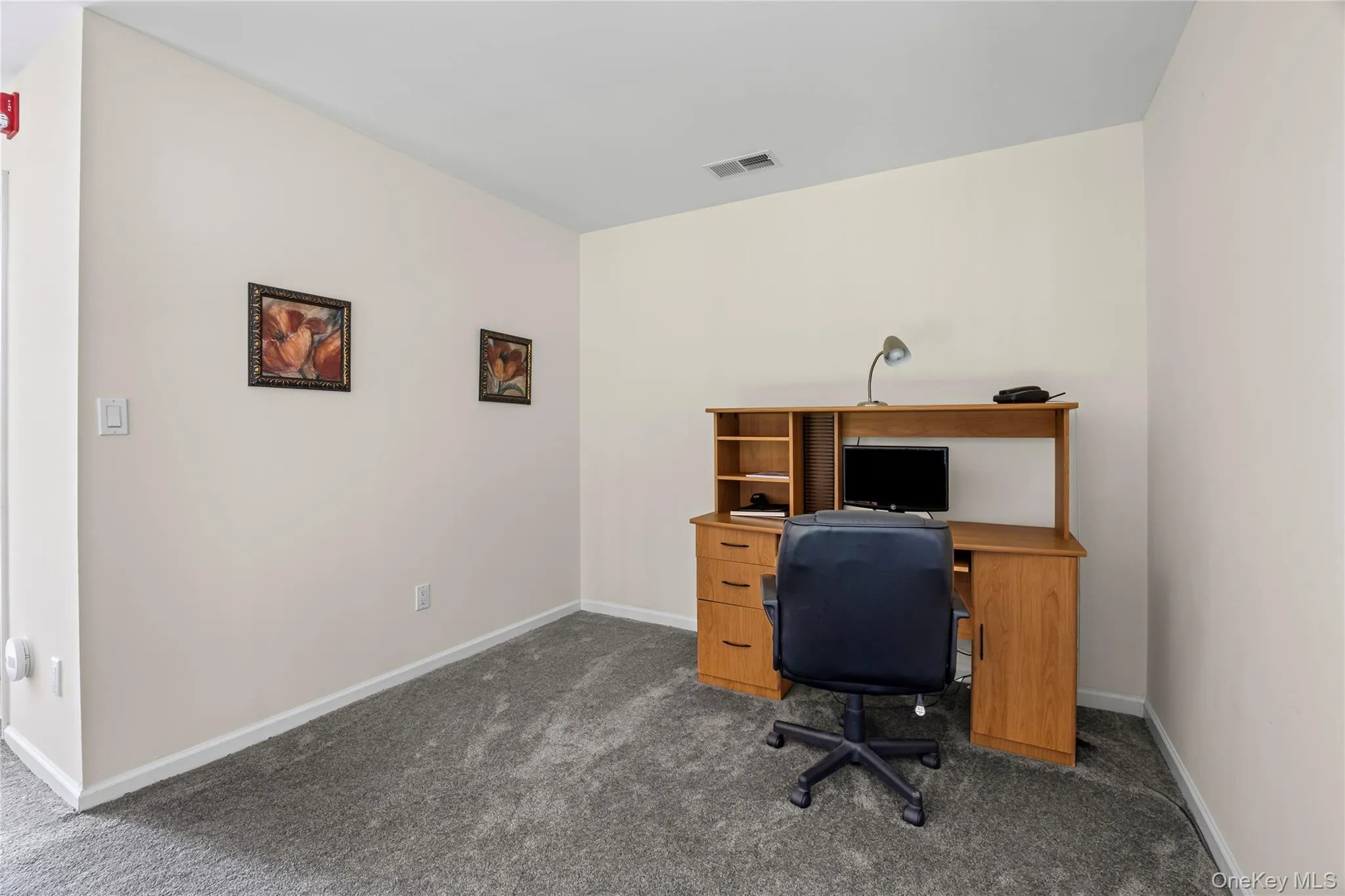 Office featuring dark carpet and baseboards Office featuring dark carpet and baseboards