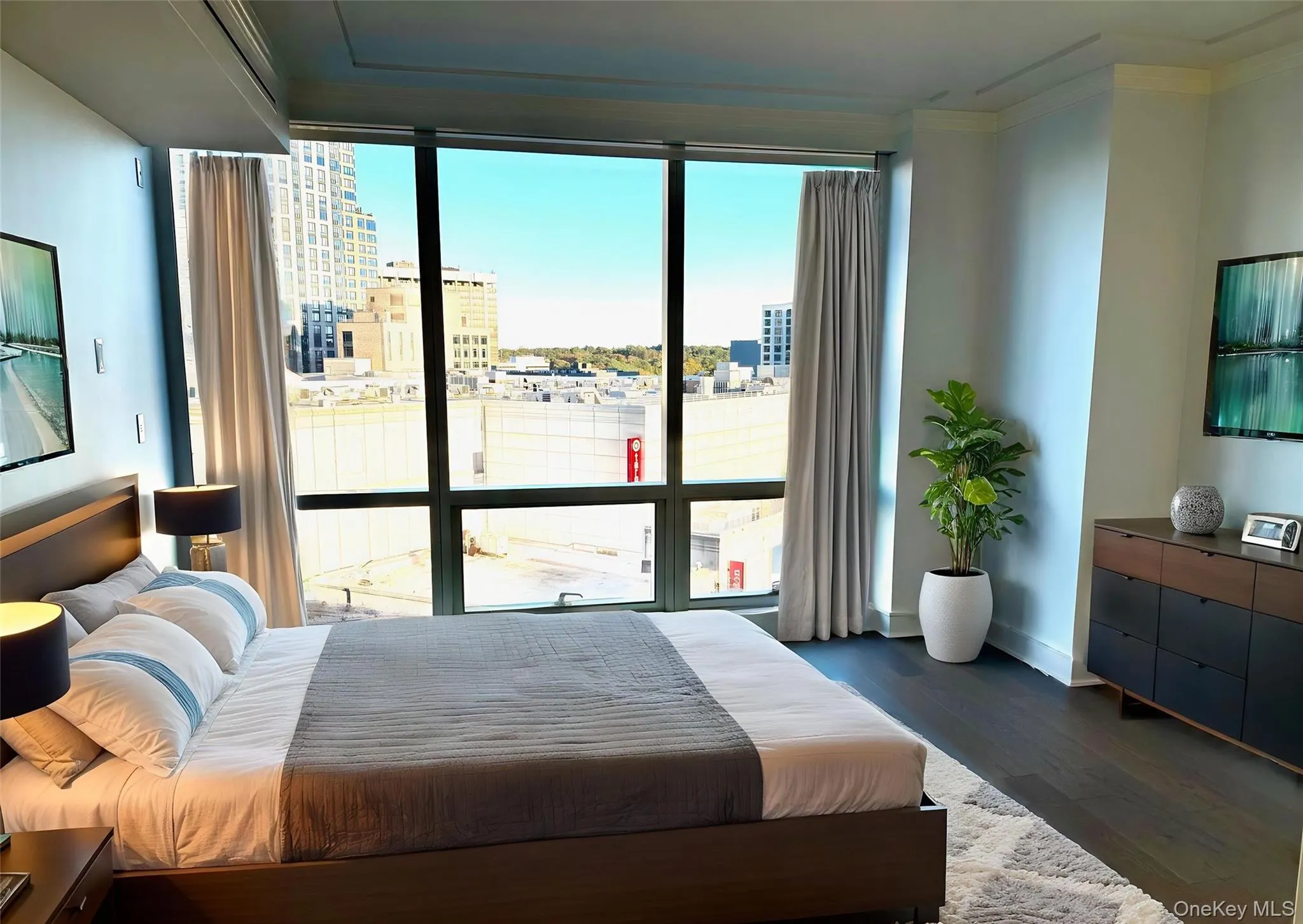 Bedroom featuring dark wood-style floors, multiple windows, a wall of windows, and crown molding Bedroom featuring dark wood-style floors, multiple windows, a wall of windows, and crown molding