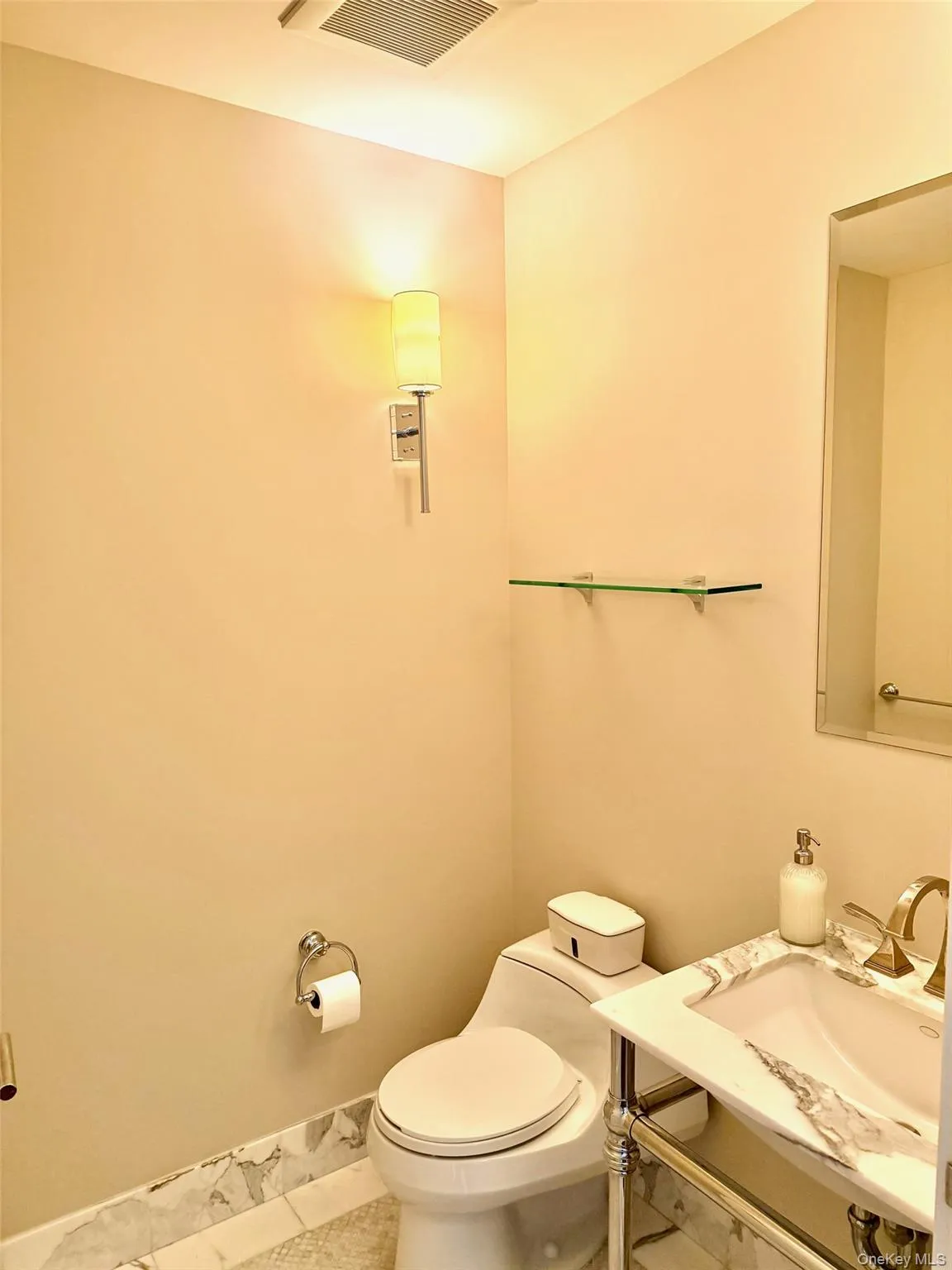 Half bathroom featuring tile patterned floors and toilet Half bathroom featuring tile patterned floors and toilet