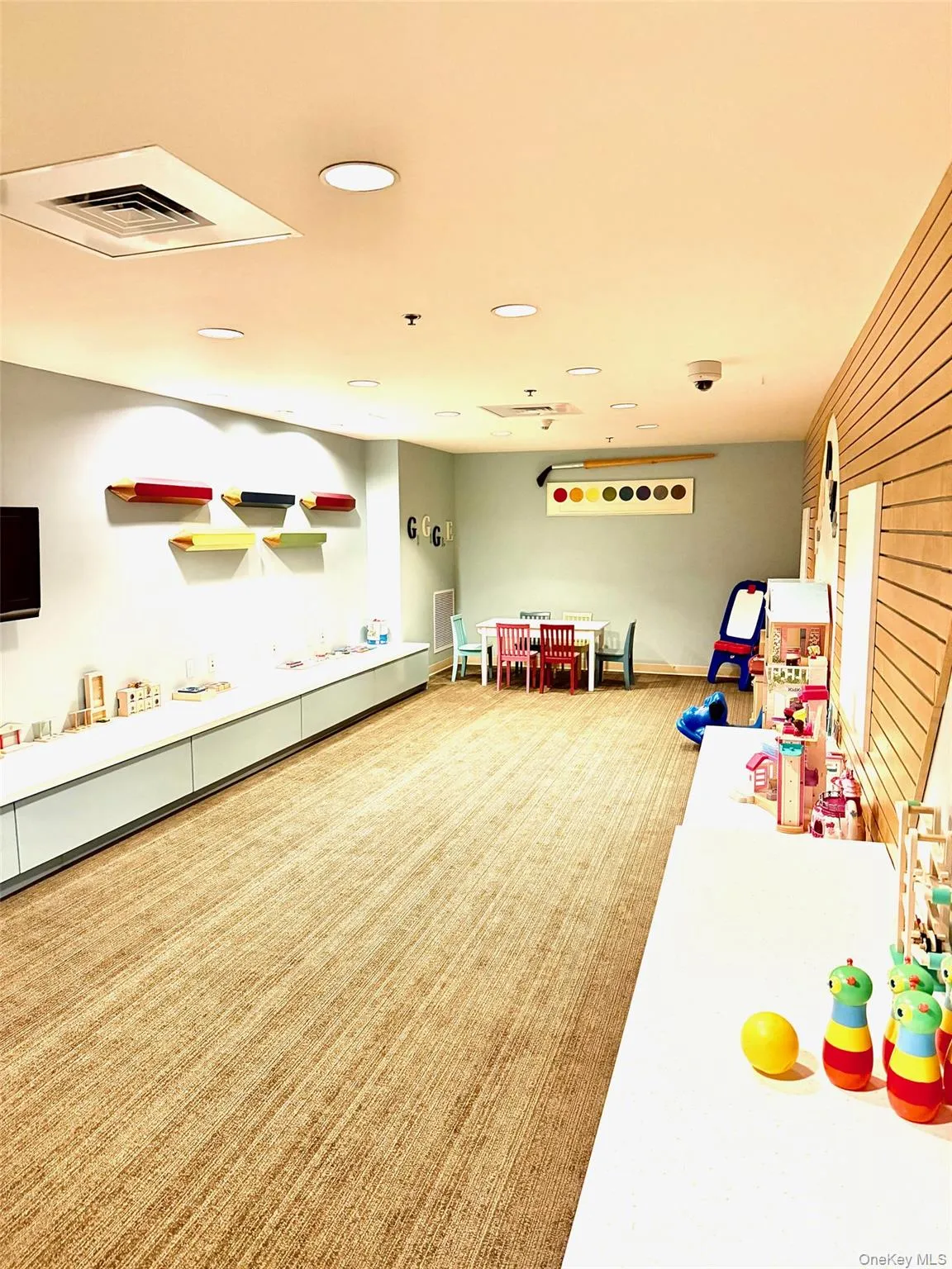 Game room with recessed lighting and wooden walls Game room with recessed lighting and wooden walls