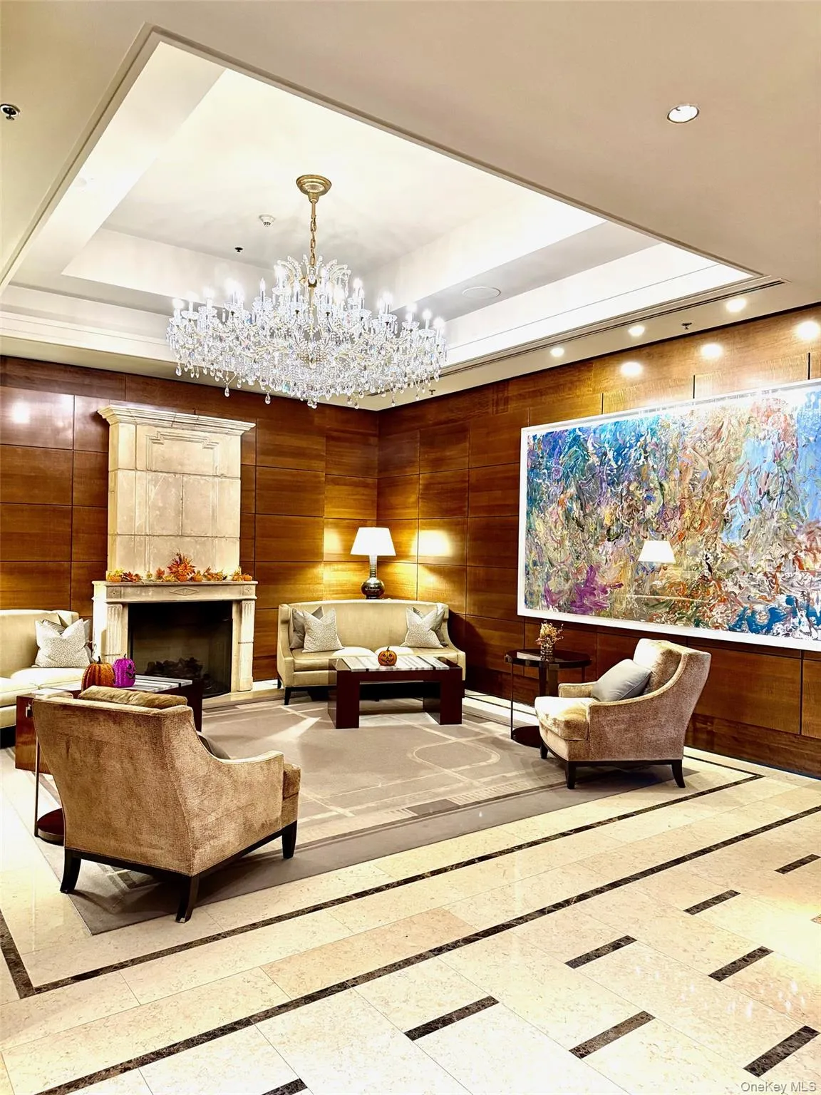 Common area with recessed lighting and wood walls Common area with recessed lighting and wood walls