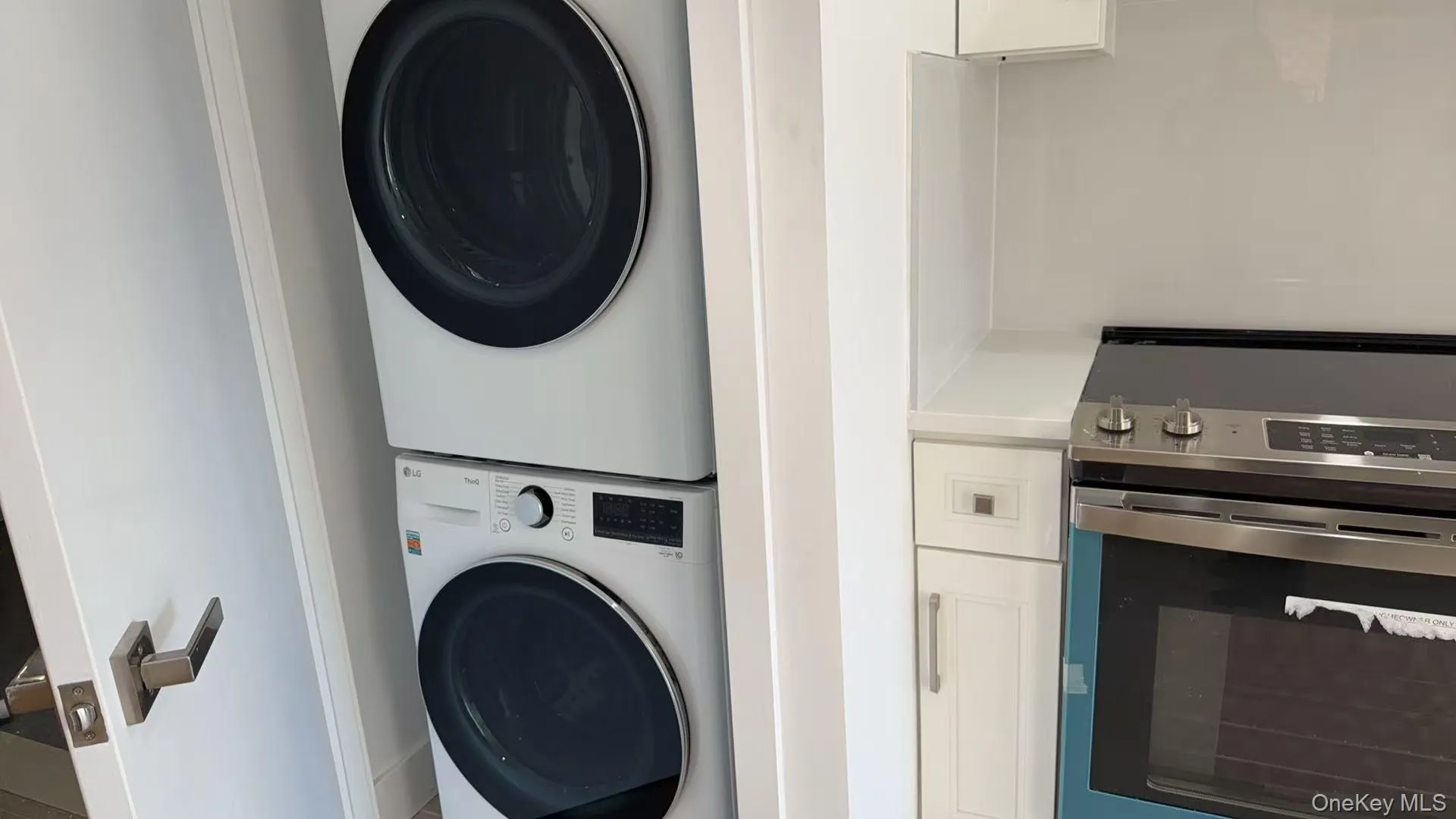Laundry room with stacked washer / drying machine Laundry room with stacked washer / drying machine