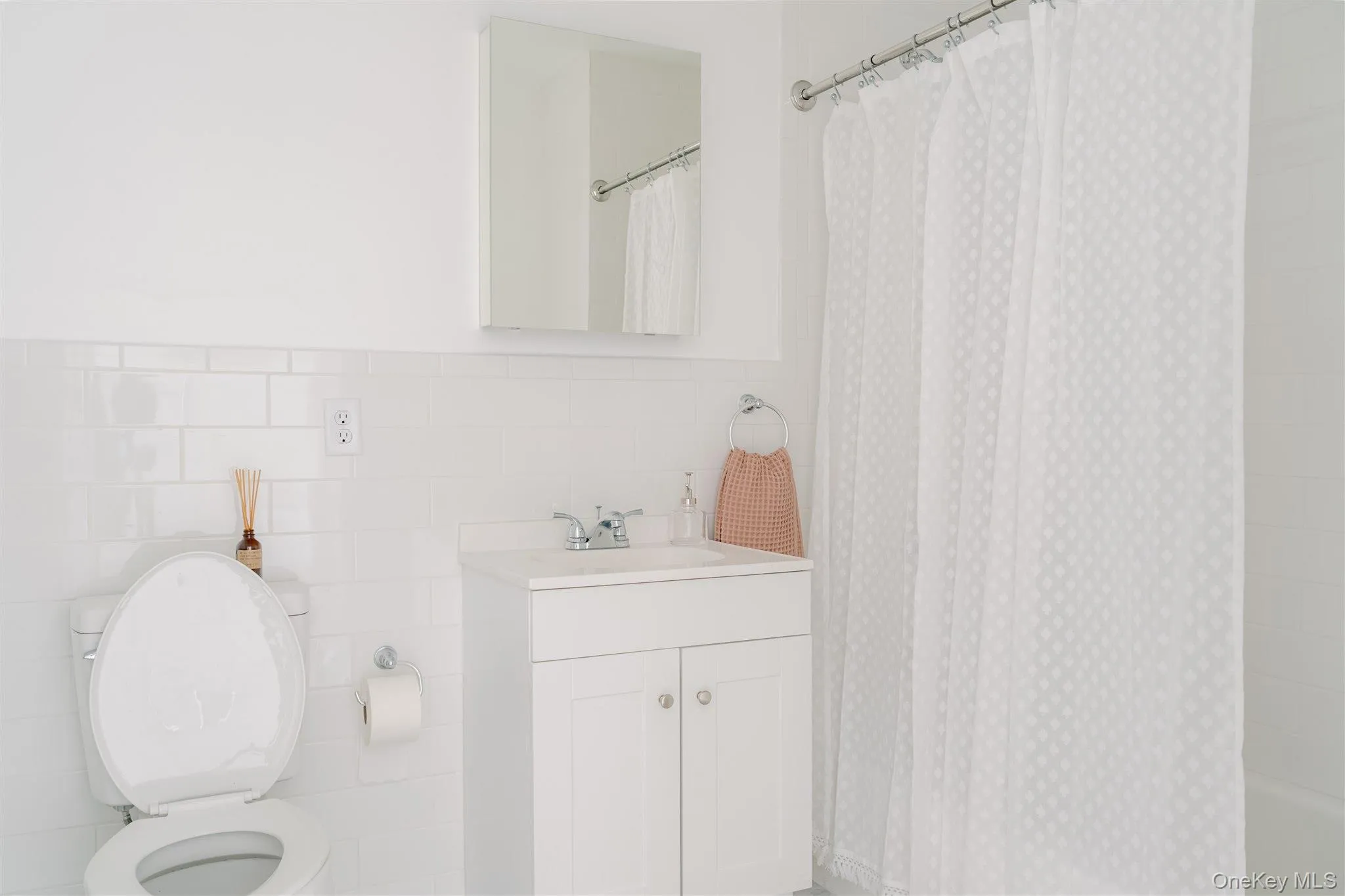 Full bath with tile walls and vanity Full bath with tile walls and vanity