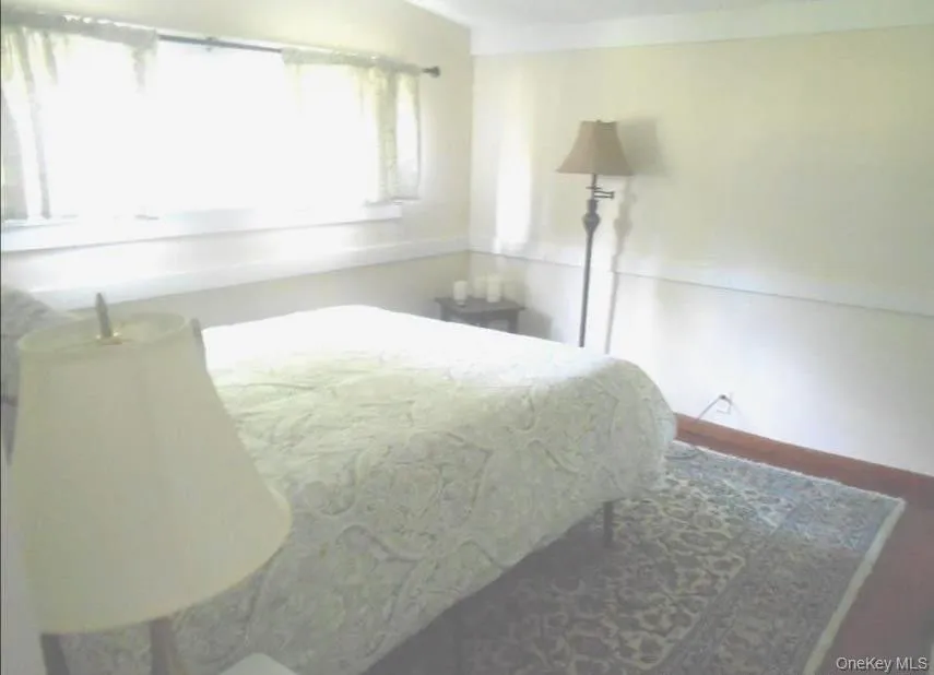 Bedroom featuring baseboards Bedroom featuring baseboards