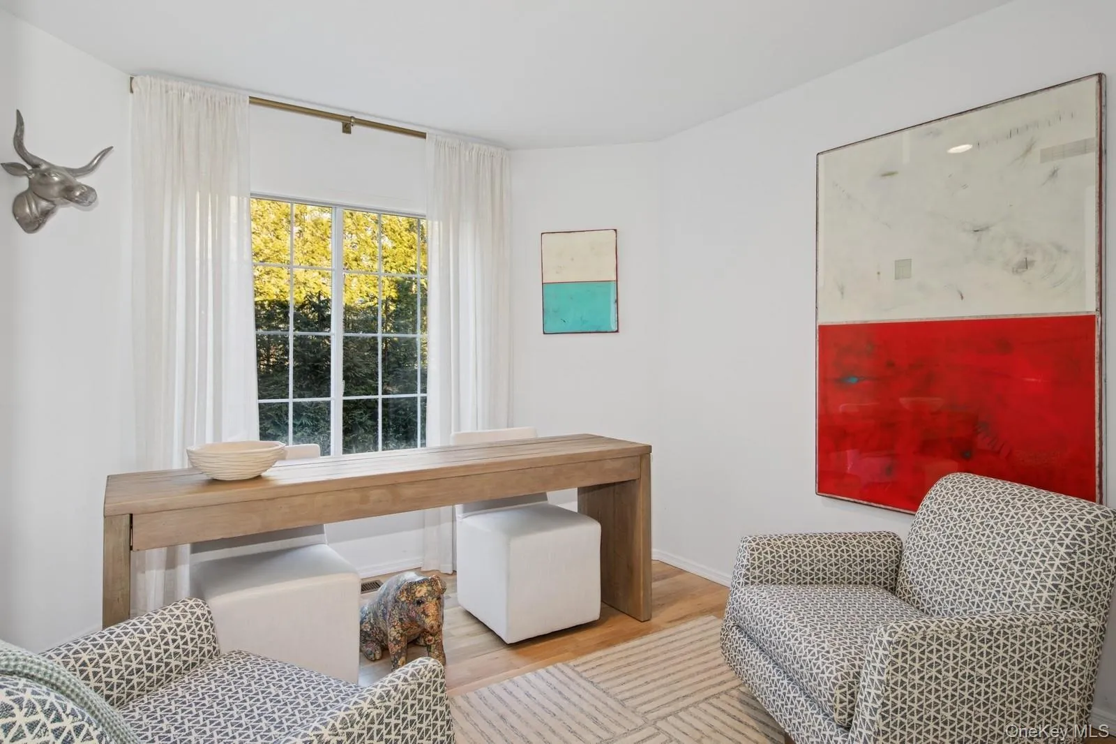 Office area with wood finished floors and baseboards Office area with wood finished floors and baseboards