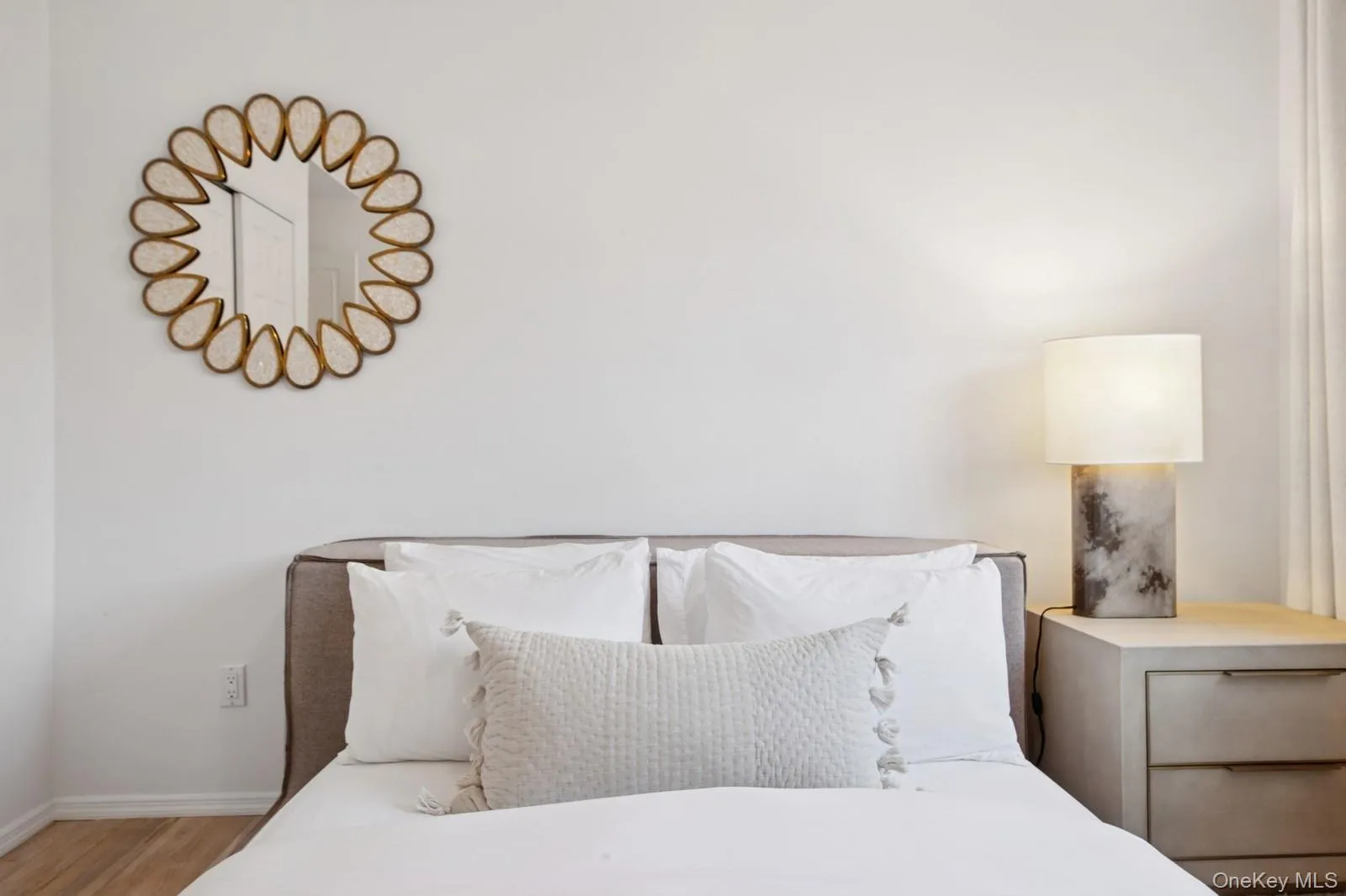 Bedroom with wood finished floors and baseboards Bedroom with wood finished floors and baseboards