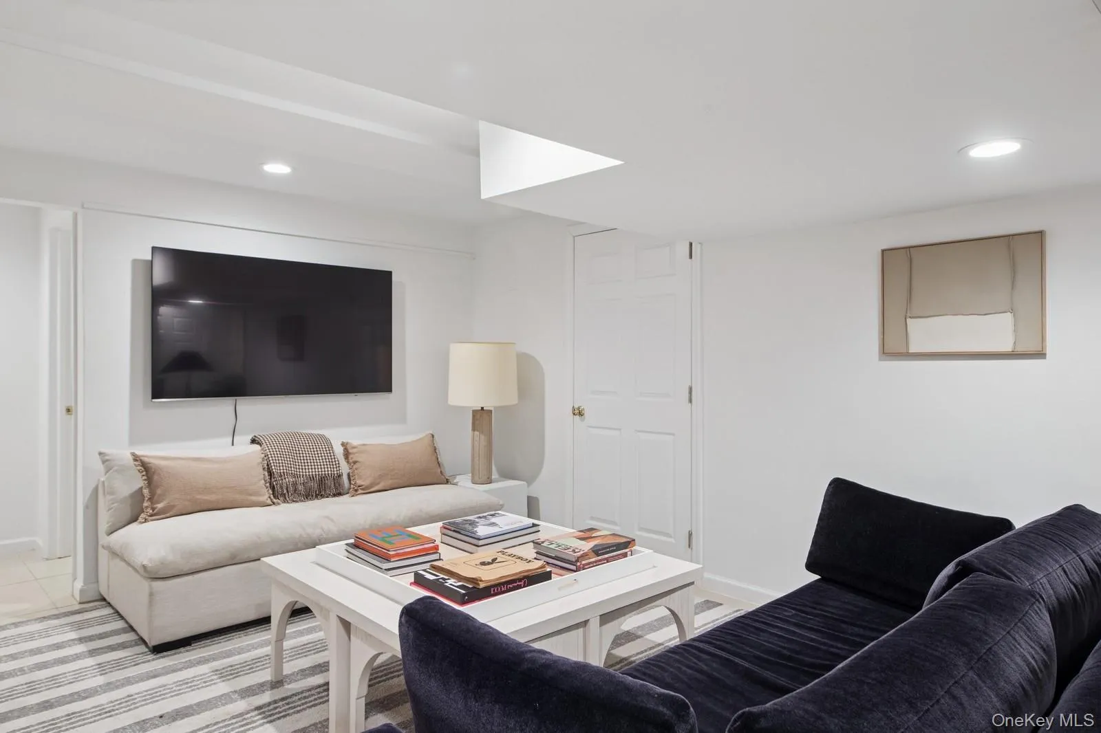 Living area featuring recessed lighting and baseboards Living area featuring recessed lighting and baseboards