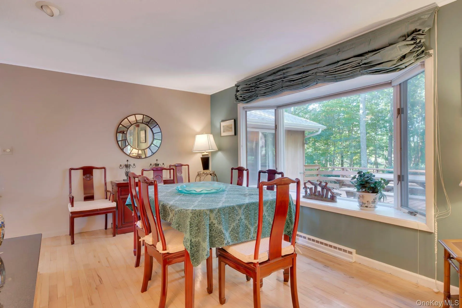 Dining room with baseboards and light wood-style flooring Dining room with baseboards and light wood-style flooring