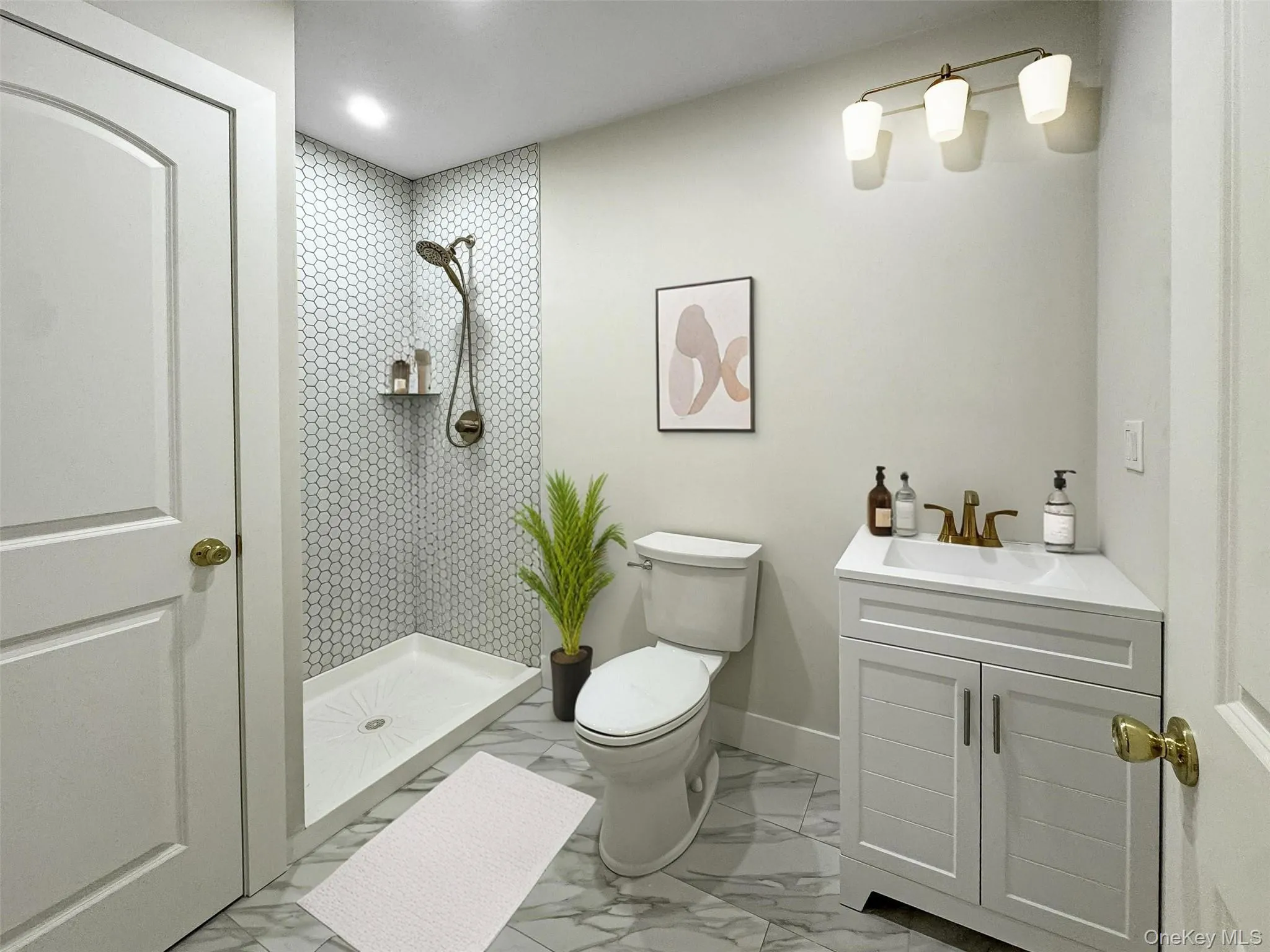 Full bathroom with a stall shower, vanity, light marble finish floors, and recessed lighting Full bathroom with a stall shower, vanity, light marble finish floors, and recessed lighting