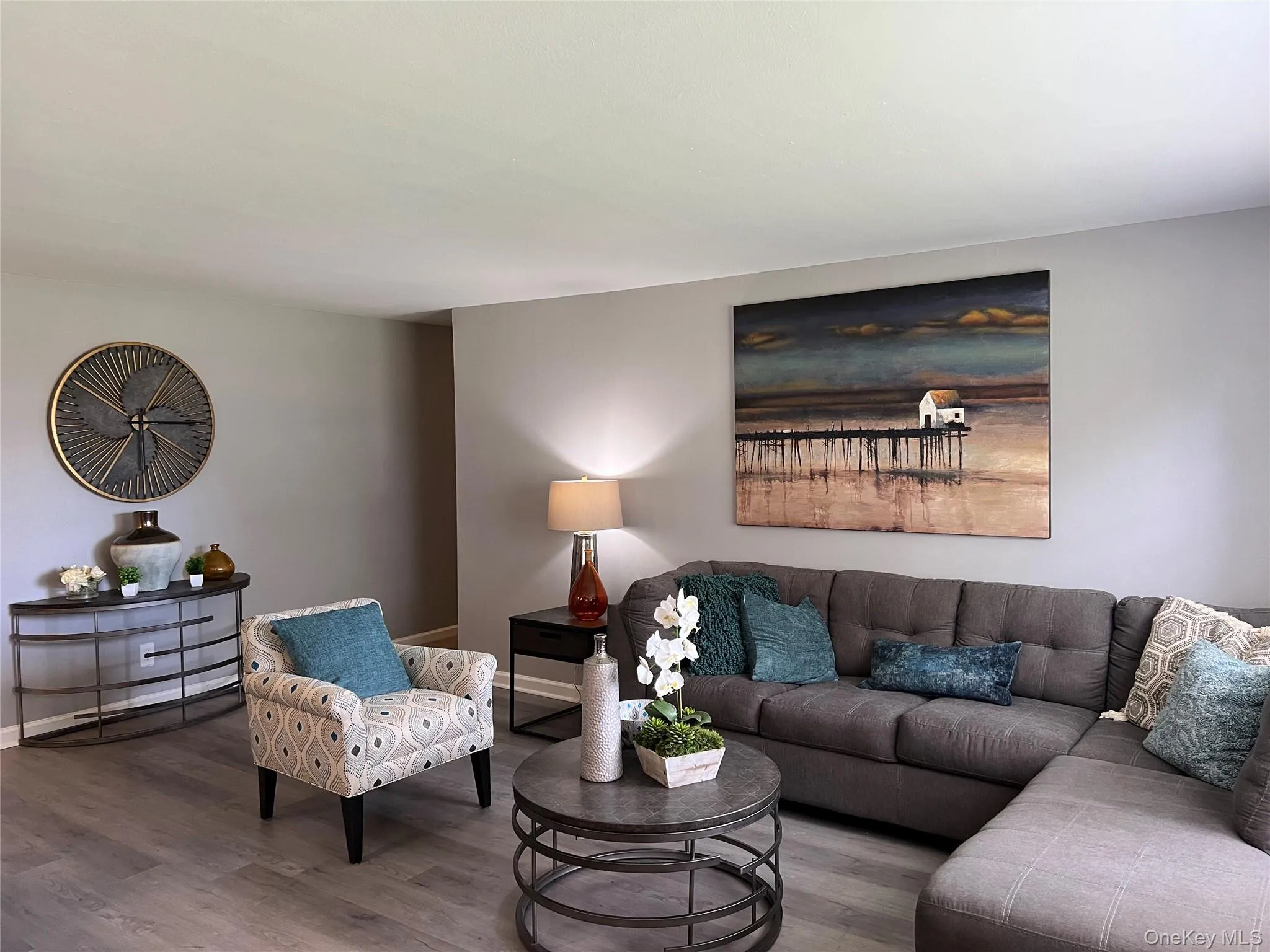 Living area with wood finished floors and baseboards Living area with wood finished floors and baseboards