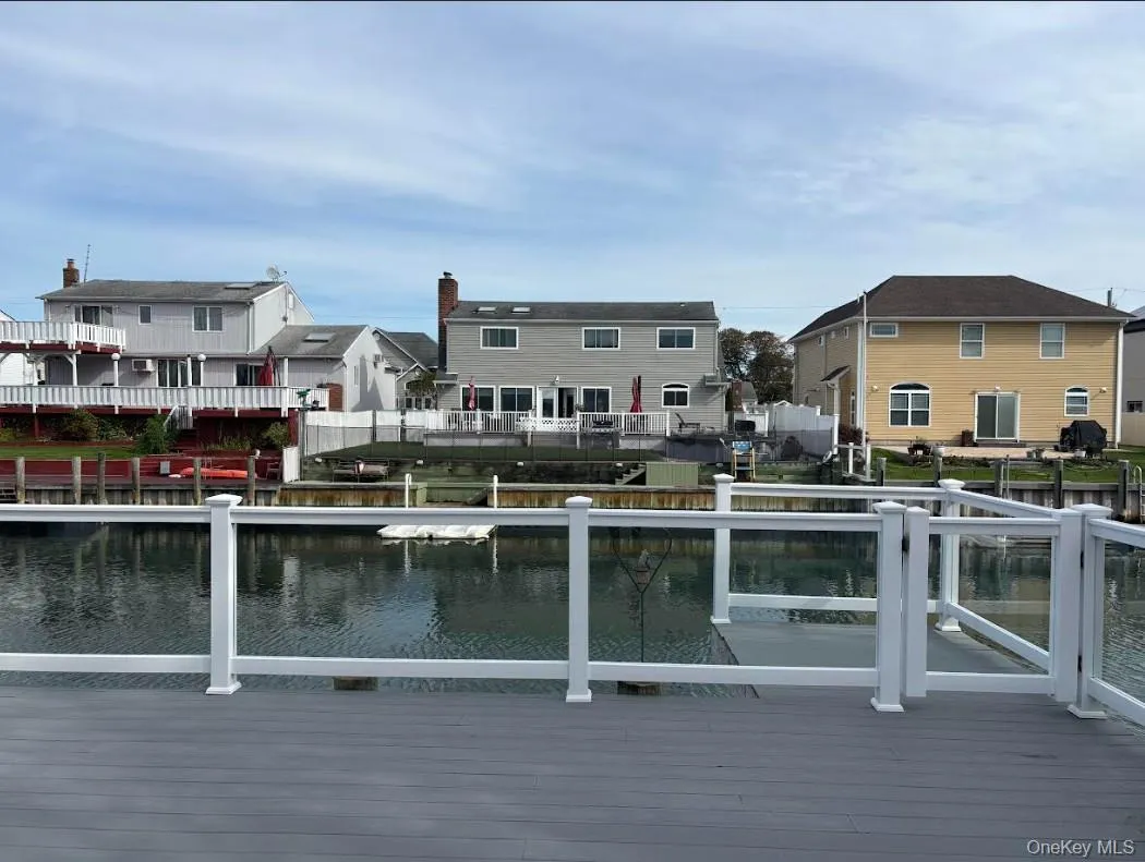 Dock area featuring a water view and a residential view Dock area featuring a water view and a residential view