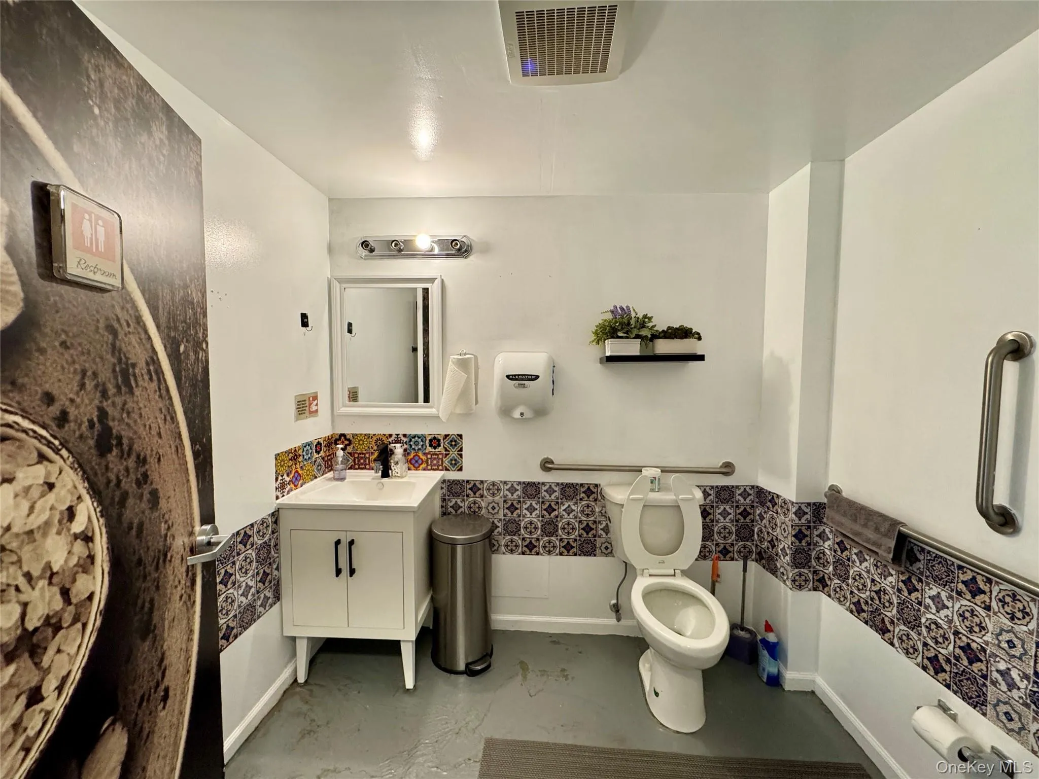 Half bath with vanity and toilet Half bath with vanity and toilet