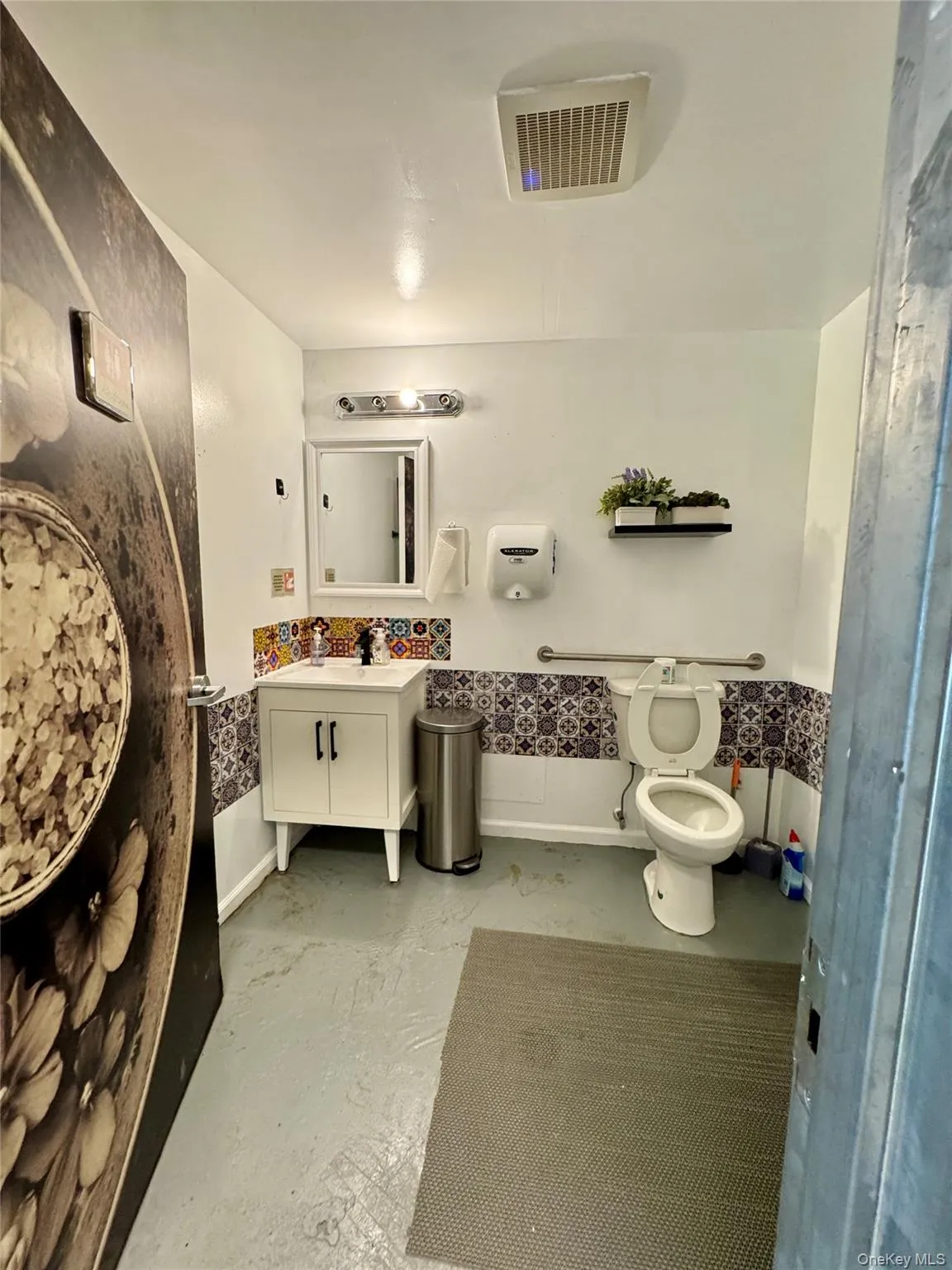 Full bath with vanity and concrete floors Full bath with vanity and concrete floors