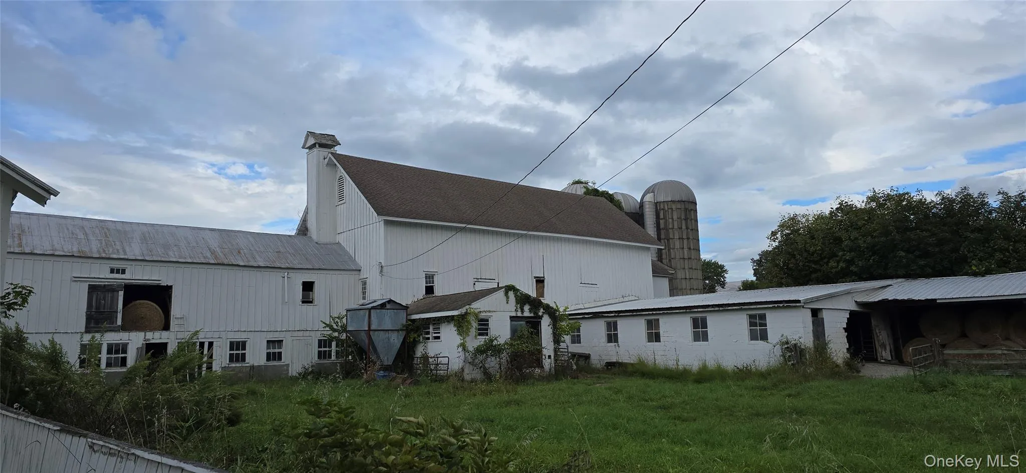 Rear view of house featuring a chimney Rear view of house featuring a chimney