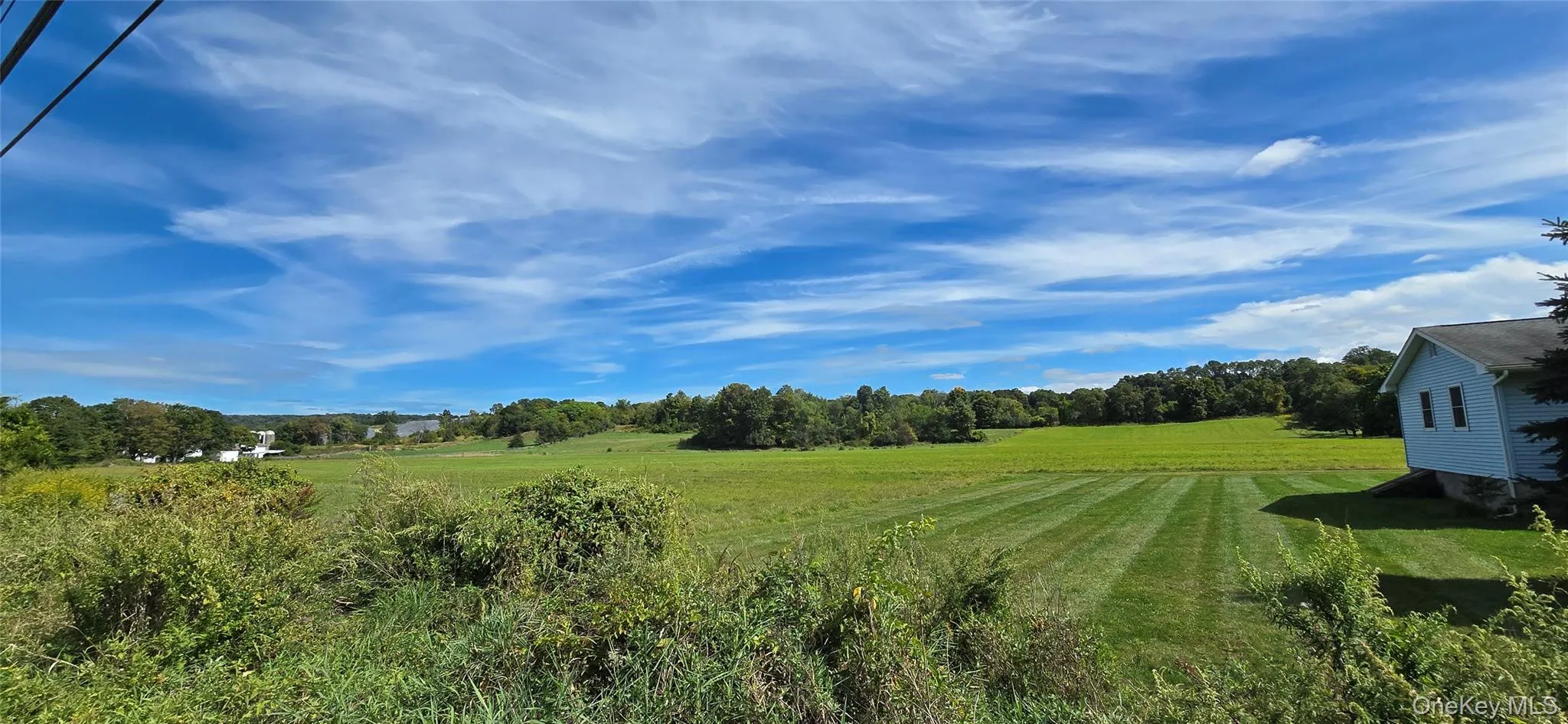 View of grassy yard featuring a rural view View of grassy yard featuring a rural view