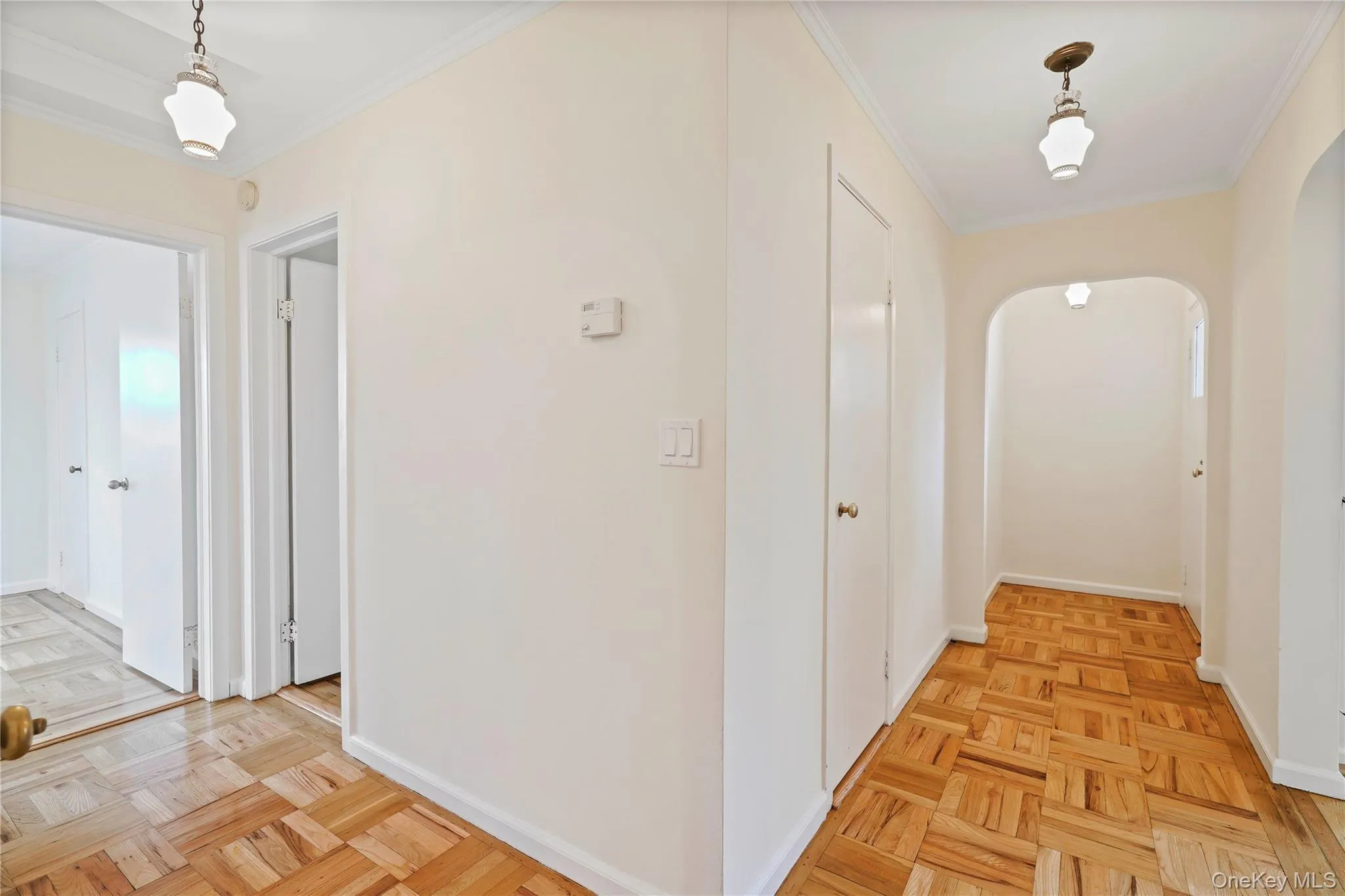 Corridor with ornamental molding and arched walkways Corridor with ornamental molding and arched walkways