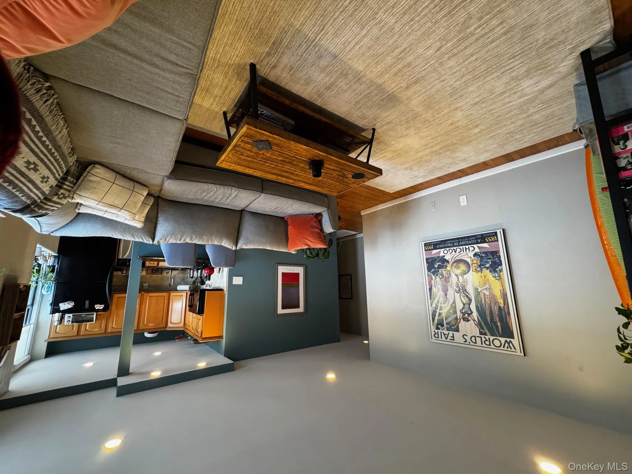 Living area with light wood finished floors, baseboards, and recessed lighting Living area with light wood finished floors, baseboards, and recessed lighting