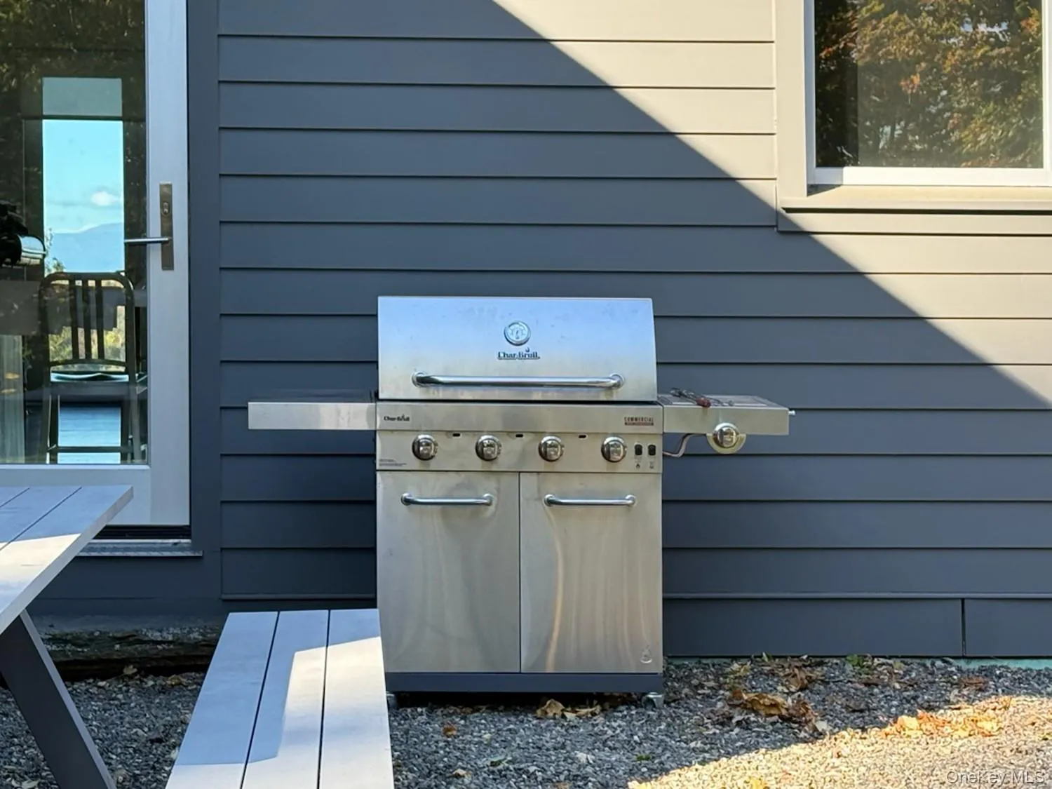 Patio with grill just off kitchen Patio with grill just off kitchen