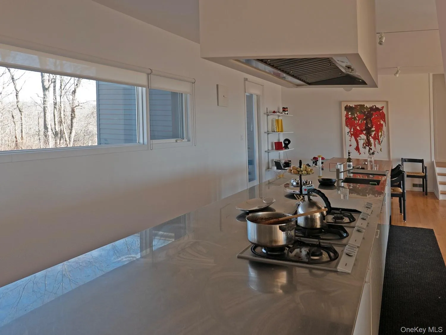 Kitchen island with eating area beyond Kitchen island with eating area beyond