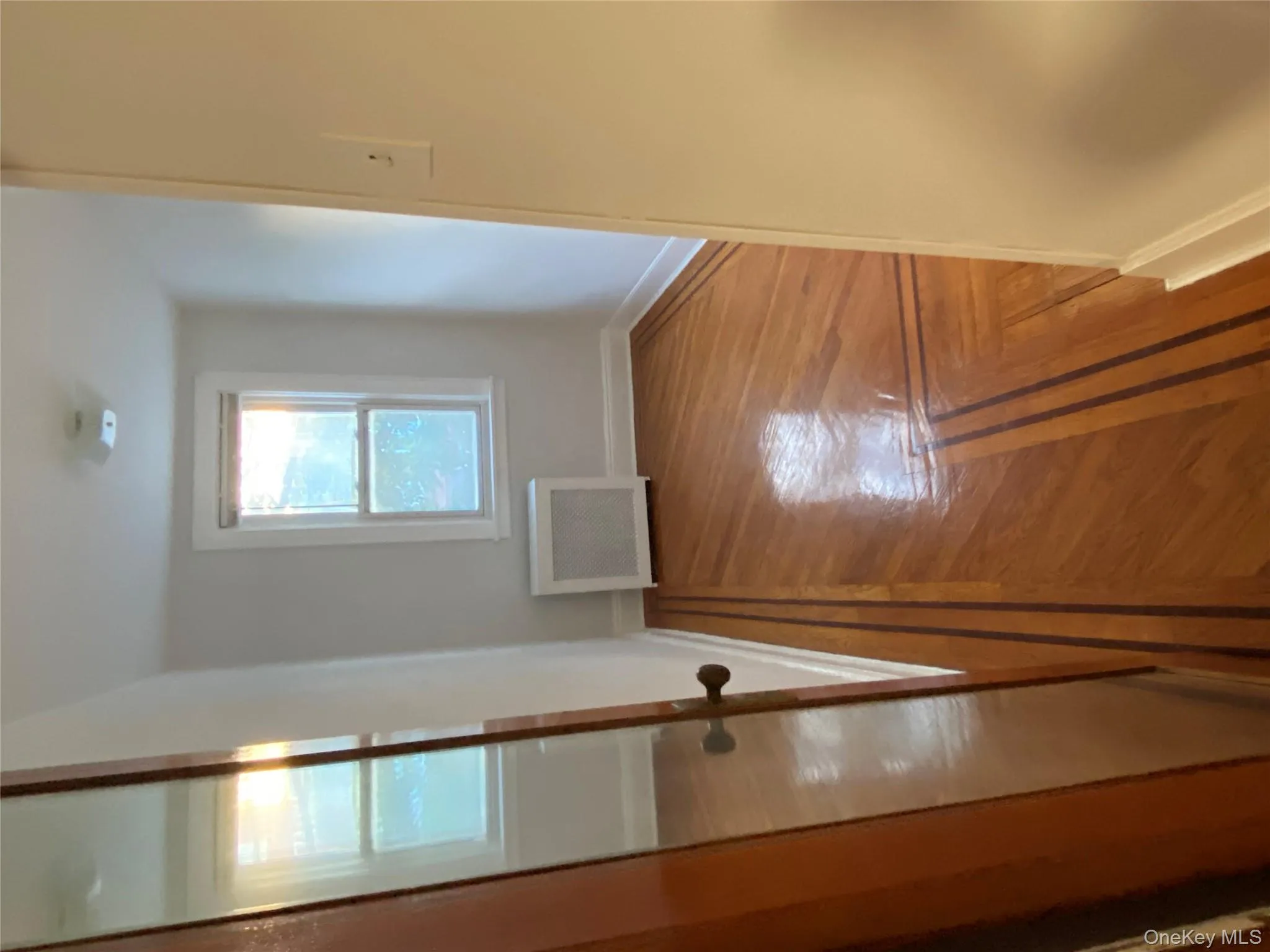 Unfurnished bedroom featuring radiator and baseboards Unfurnished bedroom featuring radiator and baseboards