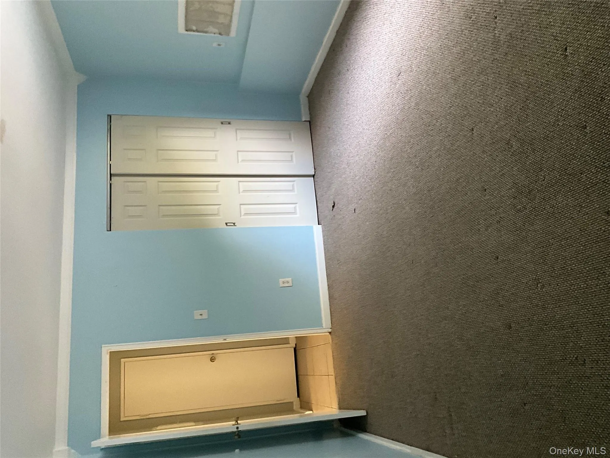 Unfurnished bedroom featuring a closet, carpet floors, and ornamental molding Unfurnished bedroom featuring a closet, carpet floors, and ornamental molding