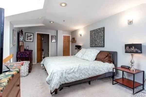 Bedroom featuring light colored carpet Bedroom featuring light colored carpet