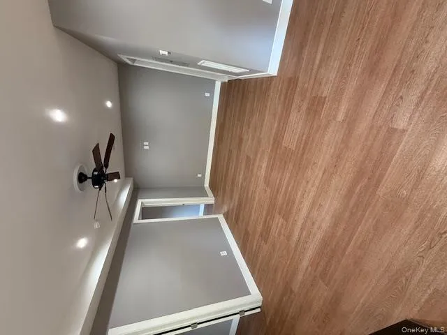 Spare room featuring a ceiling fan, recessed lighting, and light wood finished floors Spare room featuring a ceiling fan, recessed lighting, and light wood finished floors