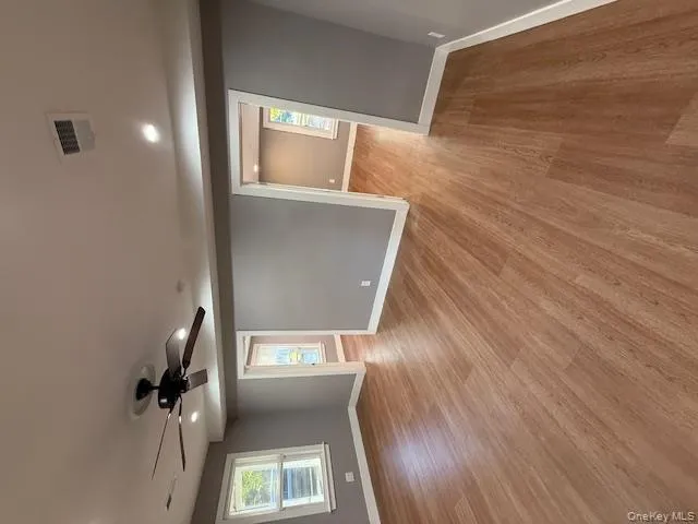 Unfurnished room featuring light wood finished floors, a ceiling fan, and recessed lighting Unfurnished room featuring light wood finished floors, a ceiling fan, and recessed lighting