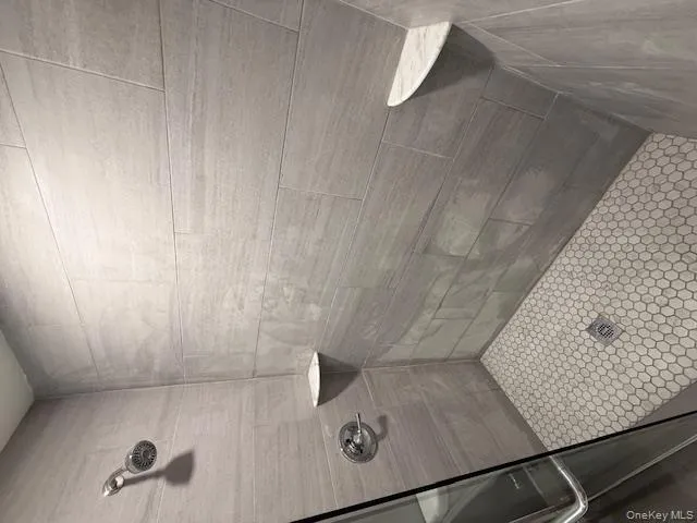 Bathroom with a tile shower Bathroom with a tile shower