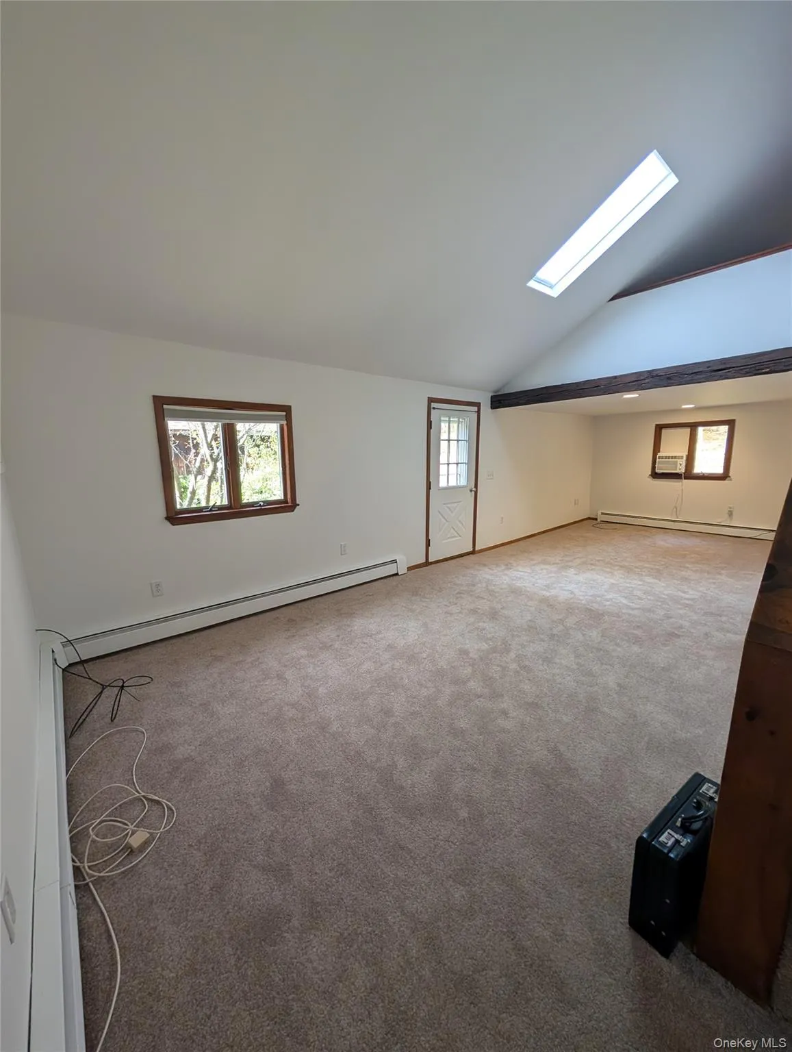 View of the living room and dining room combo. Skylight and Fan. View of the living room and dining room combo. Skylight and Fan.