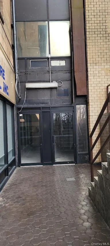View of exterior entry with brick siding View of exterior entry with brick siding
