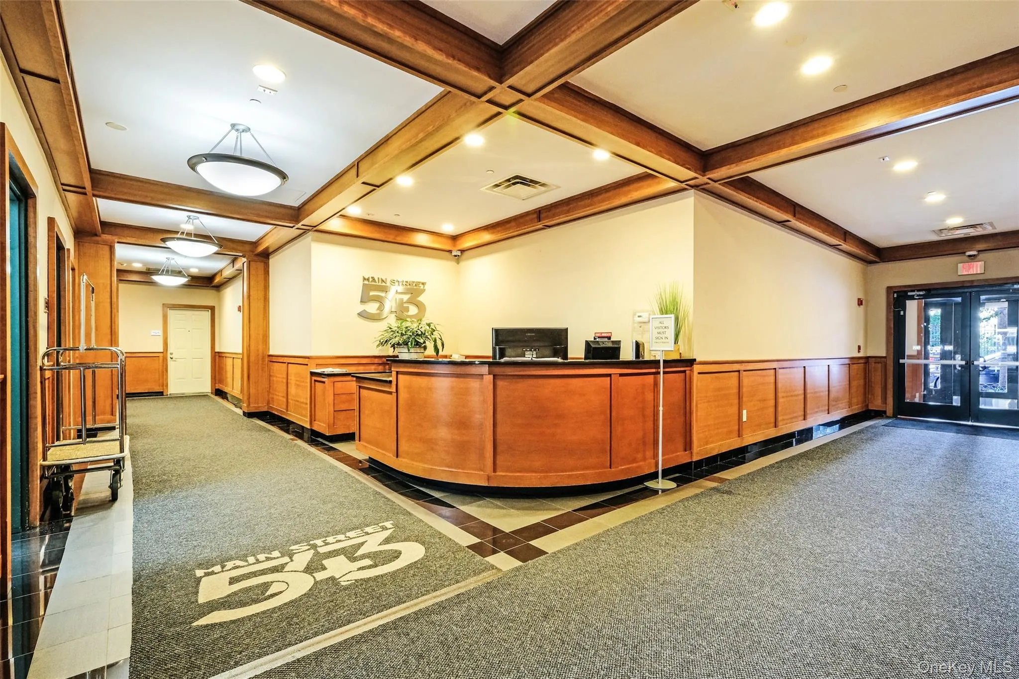 Reception featuring wainscoting, beamed ceiling, recessed lighting, and coffered ceiling Reception featuring wainscoting, beamed ceiling, recessed lighting, and coffered ceiling