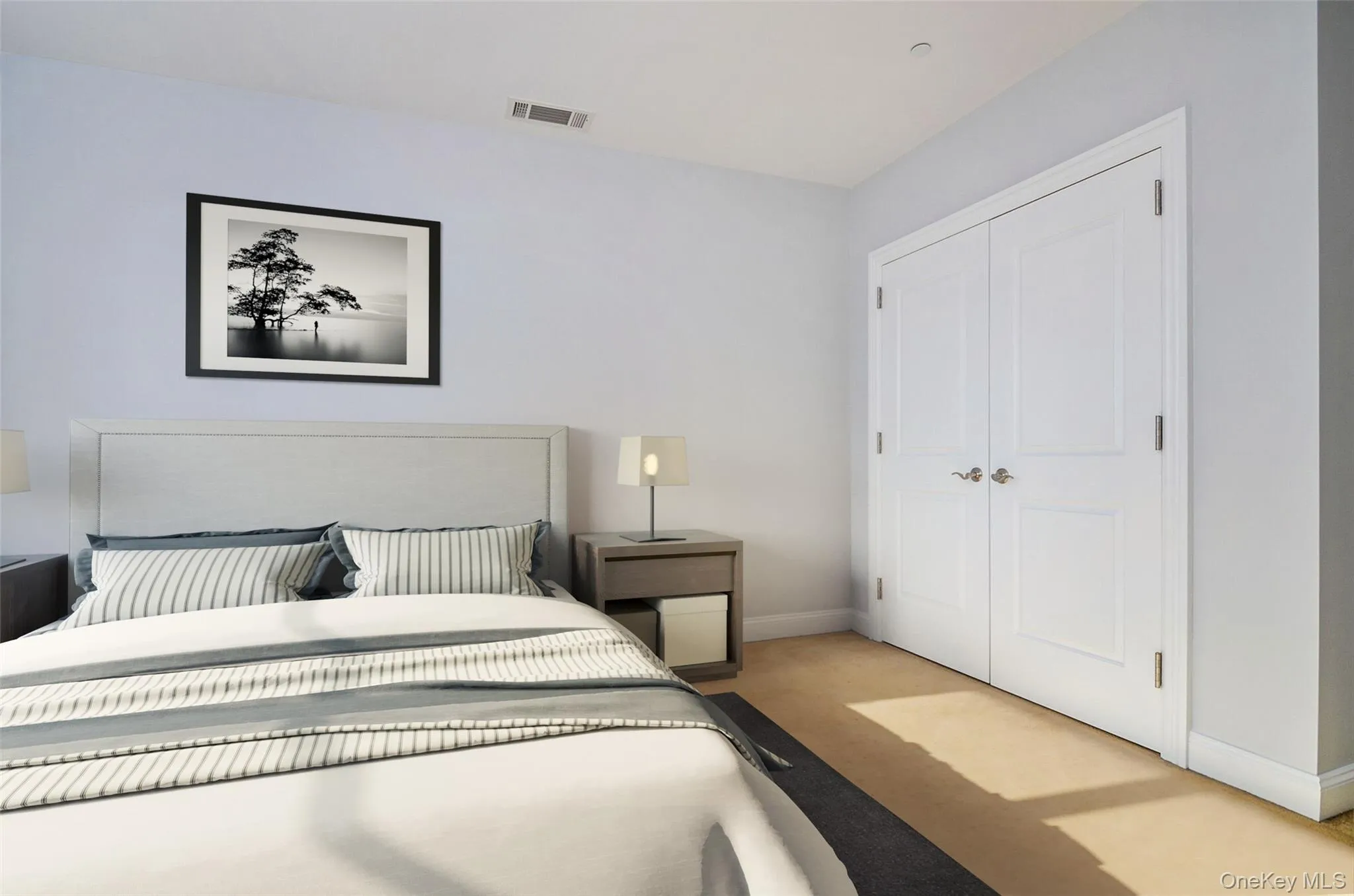 Bedroom with light colored carpet and a closet Bedroom with light colored carpet and a closet