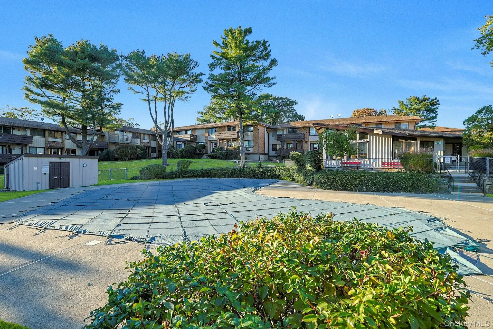 Community pool with an outdoor structure Community pool with an outdoor structure