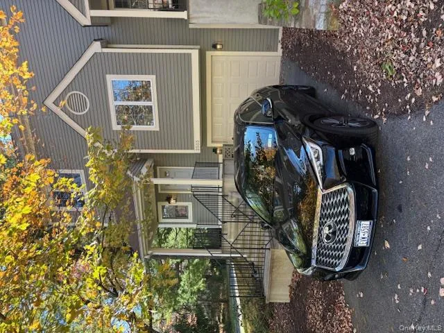 View of front facade with asphalt driveway and a garage View of front facade with asphalt driveway and a garage