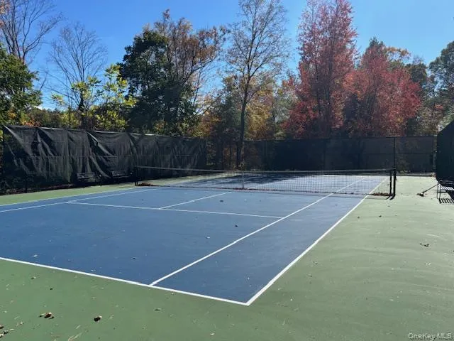 View of tennis court with community basketball court View of tennis court with community basketball court
