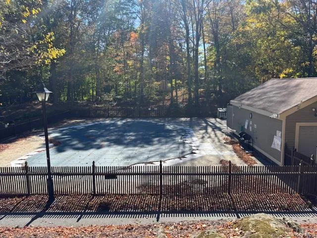 View of pool with a fenced backyard and a patio View of pool with a fenced backyard and a patio