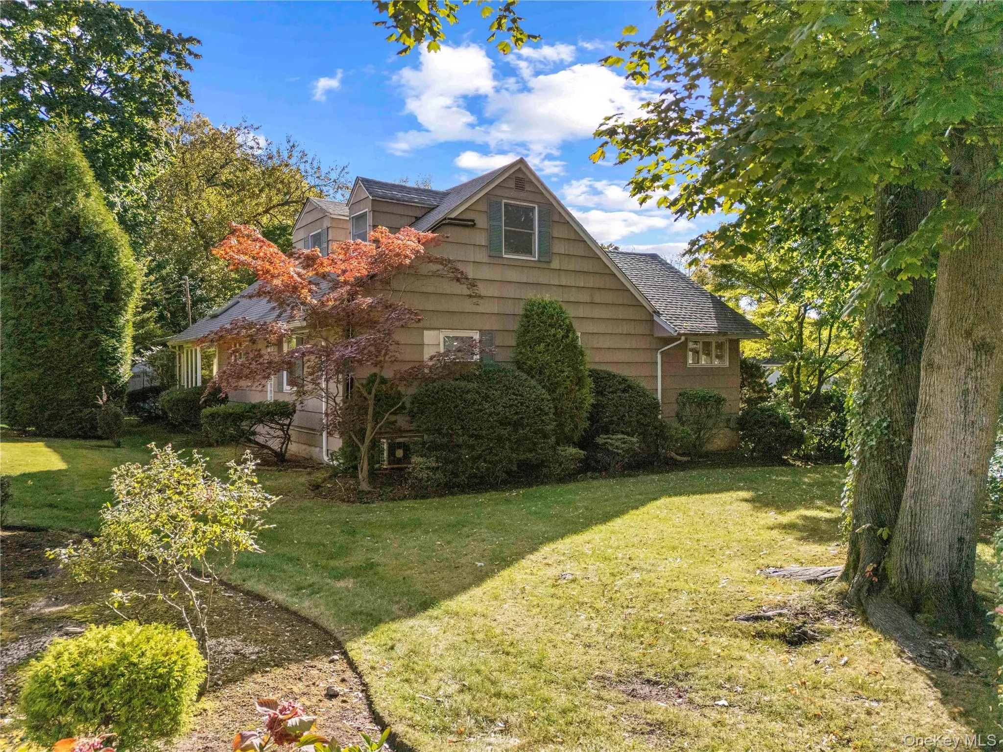 View of side of property featuring a yard View of side of property featuring a yard