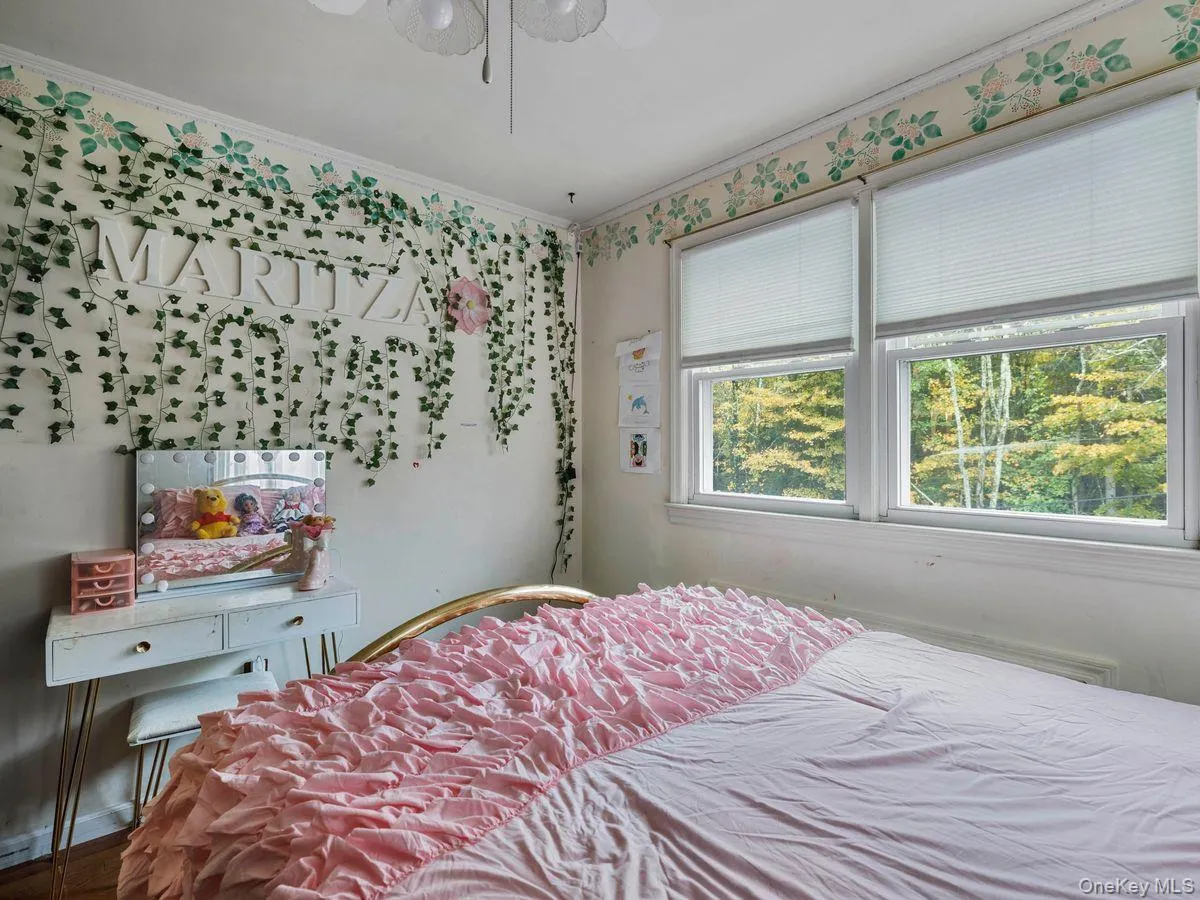 Bedroom featuring crown molding and a ceiling fan Bedroom featuring crown molding and a ceiling fan