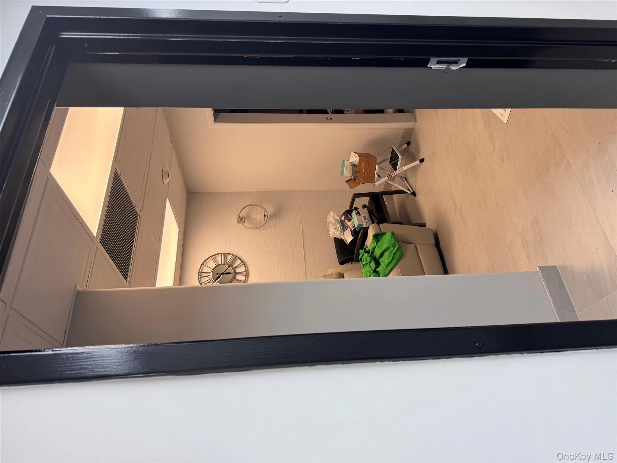Hallway featuring a drop ceiling and baseboards Hallway featuring a drop ceiling and baseboards