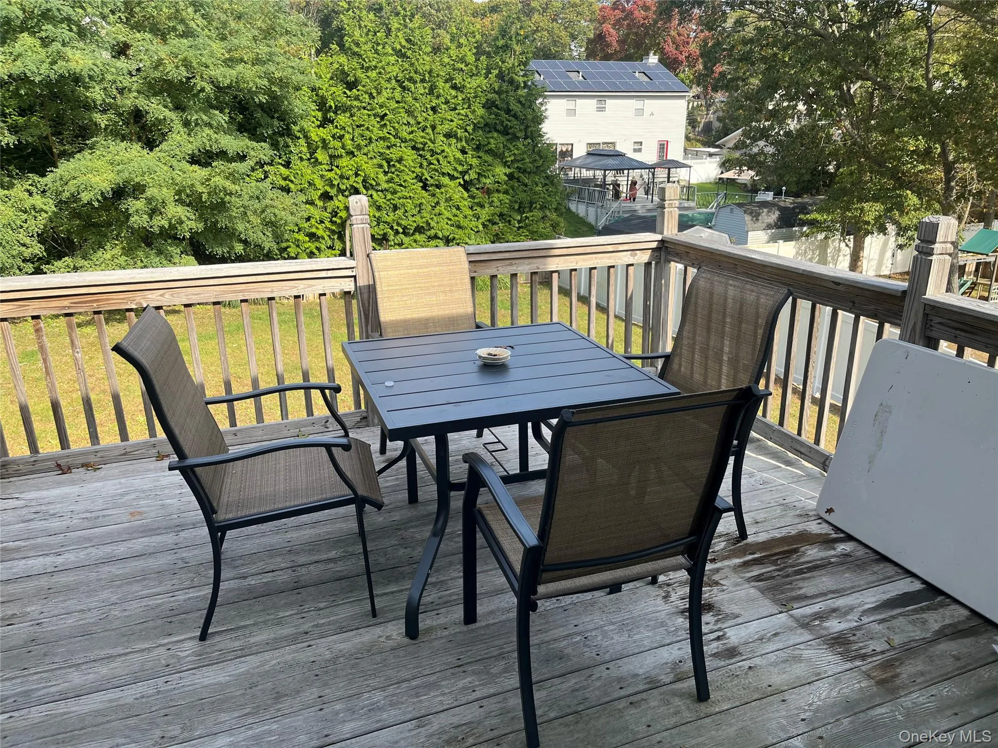 Wooden terrace featuring outdoor dining space Wooden terrace featuring outdoor dining space