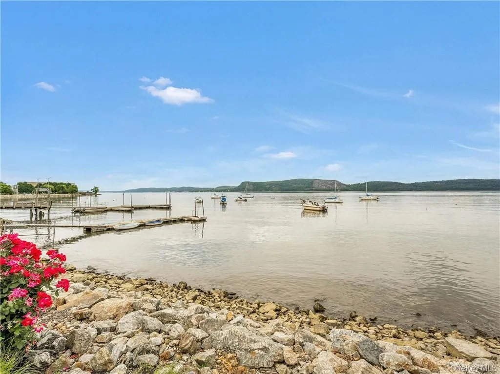 Water view featuring a floating dock Water view featuring a floating dock
