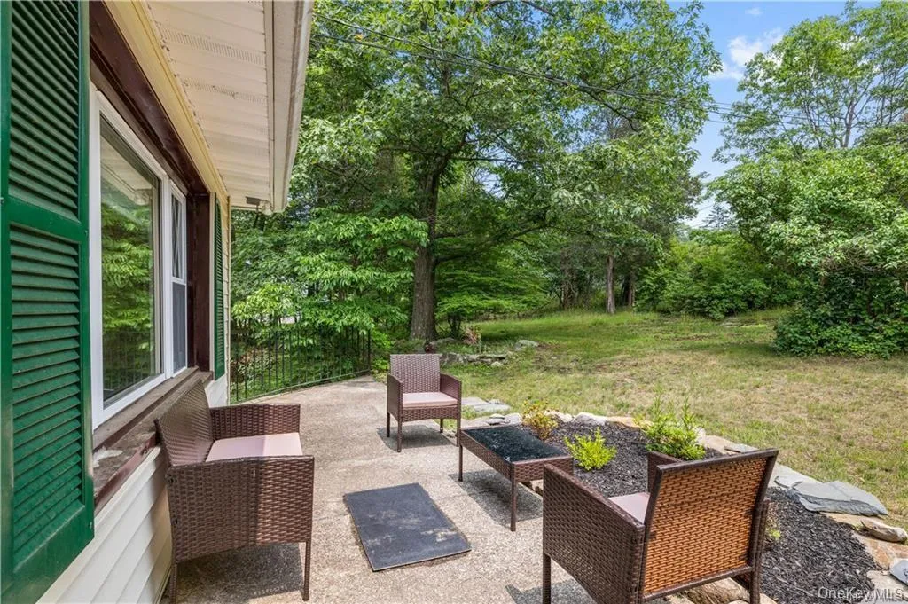View of patio with view of scattered trees and outdoor lounge area View of patio with view of scattered trees and outdoor lounge area