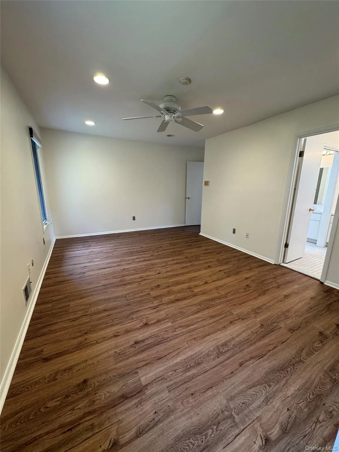 Unfurnished room featuring dark wood-type flooring, recessed lighting, and ceiling fan Unfurnished room featuring dark wood-type flooring, recessed lighting, and ceiling fan