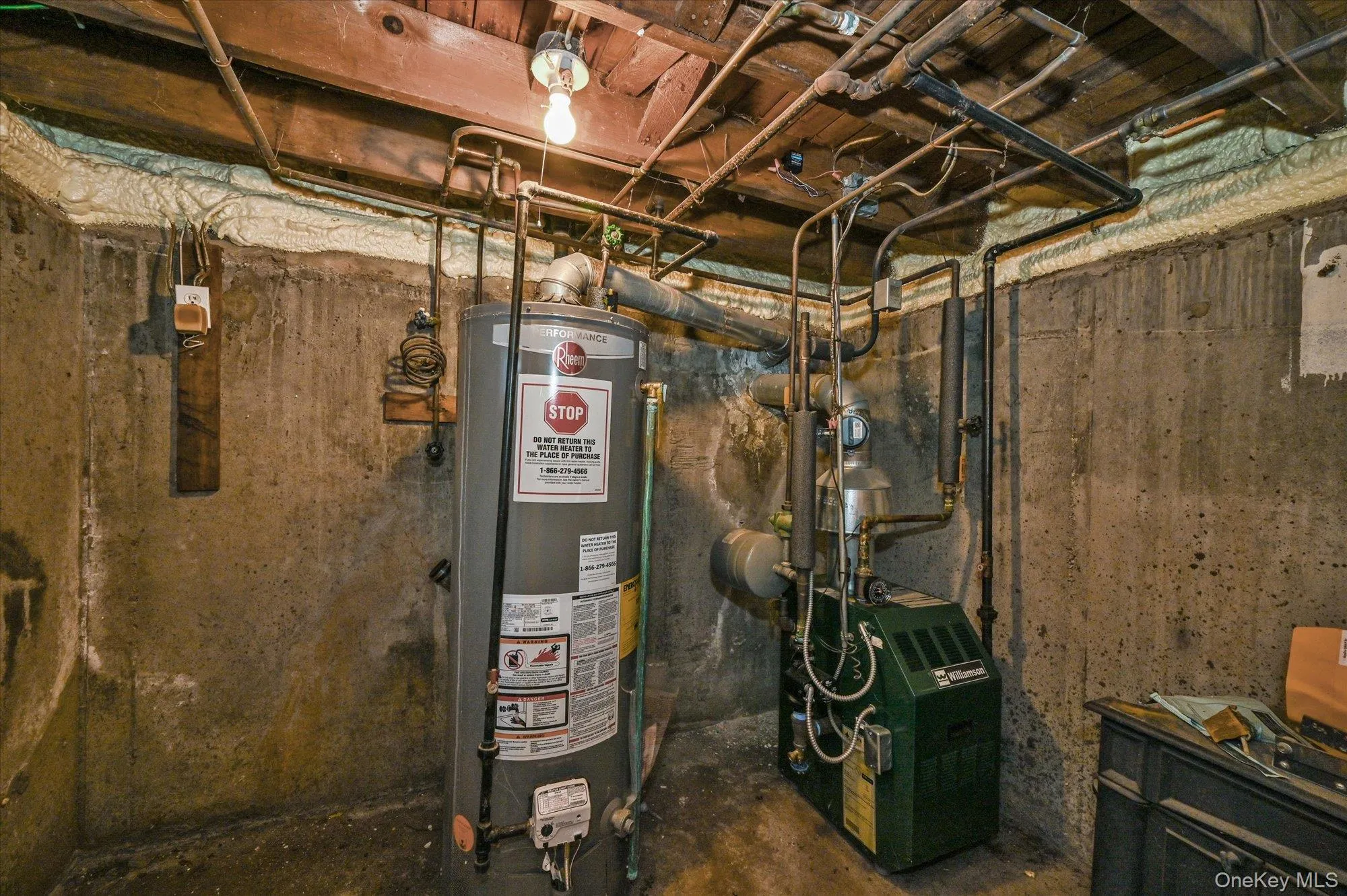Utility room with water heater Utility room with water heater