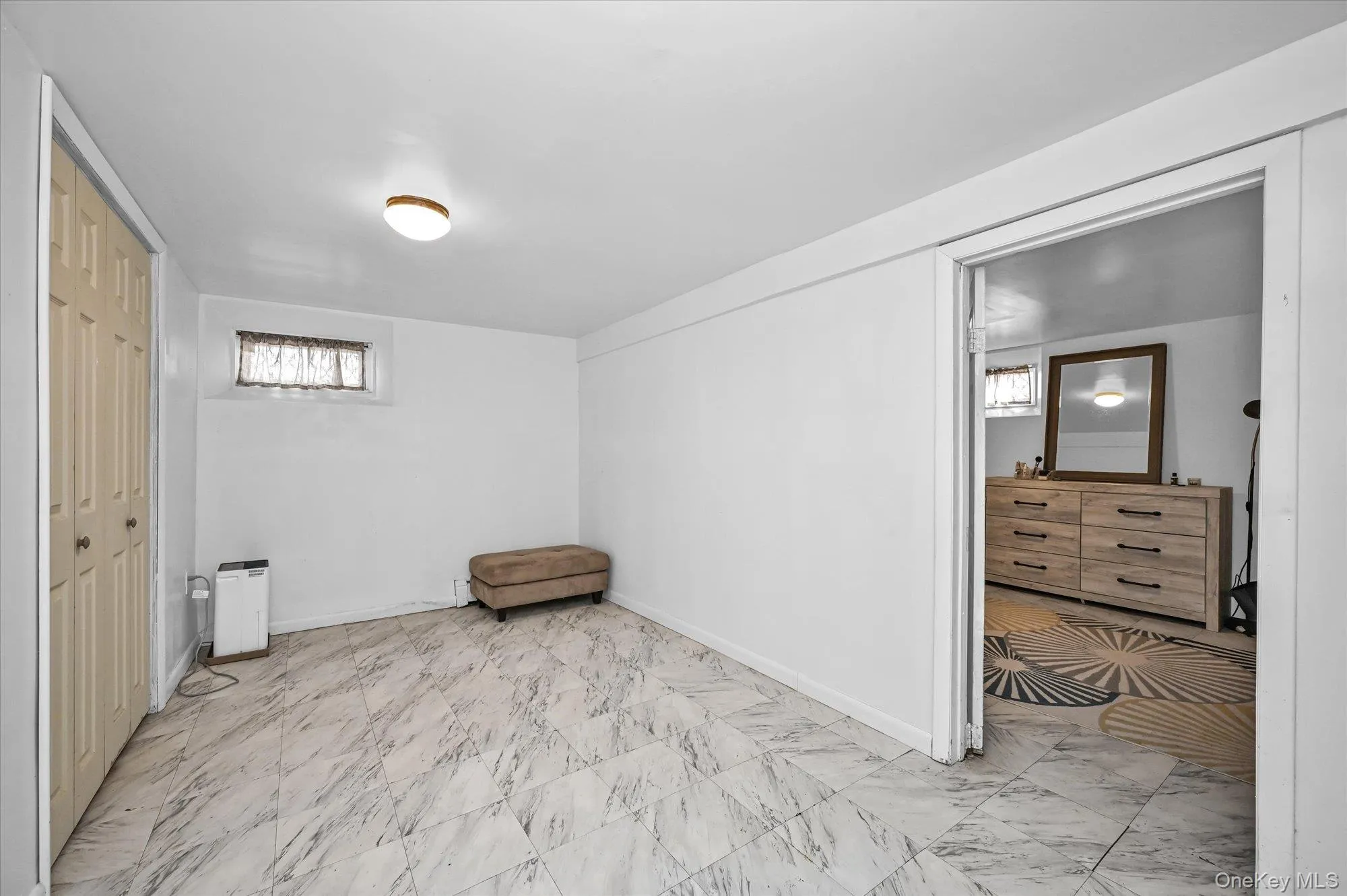 Unfurnished bedroom with a closet and baseboards Unfurnished bedroom with a closet and baseboards