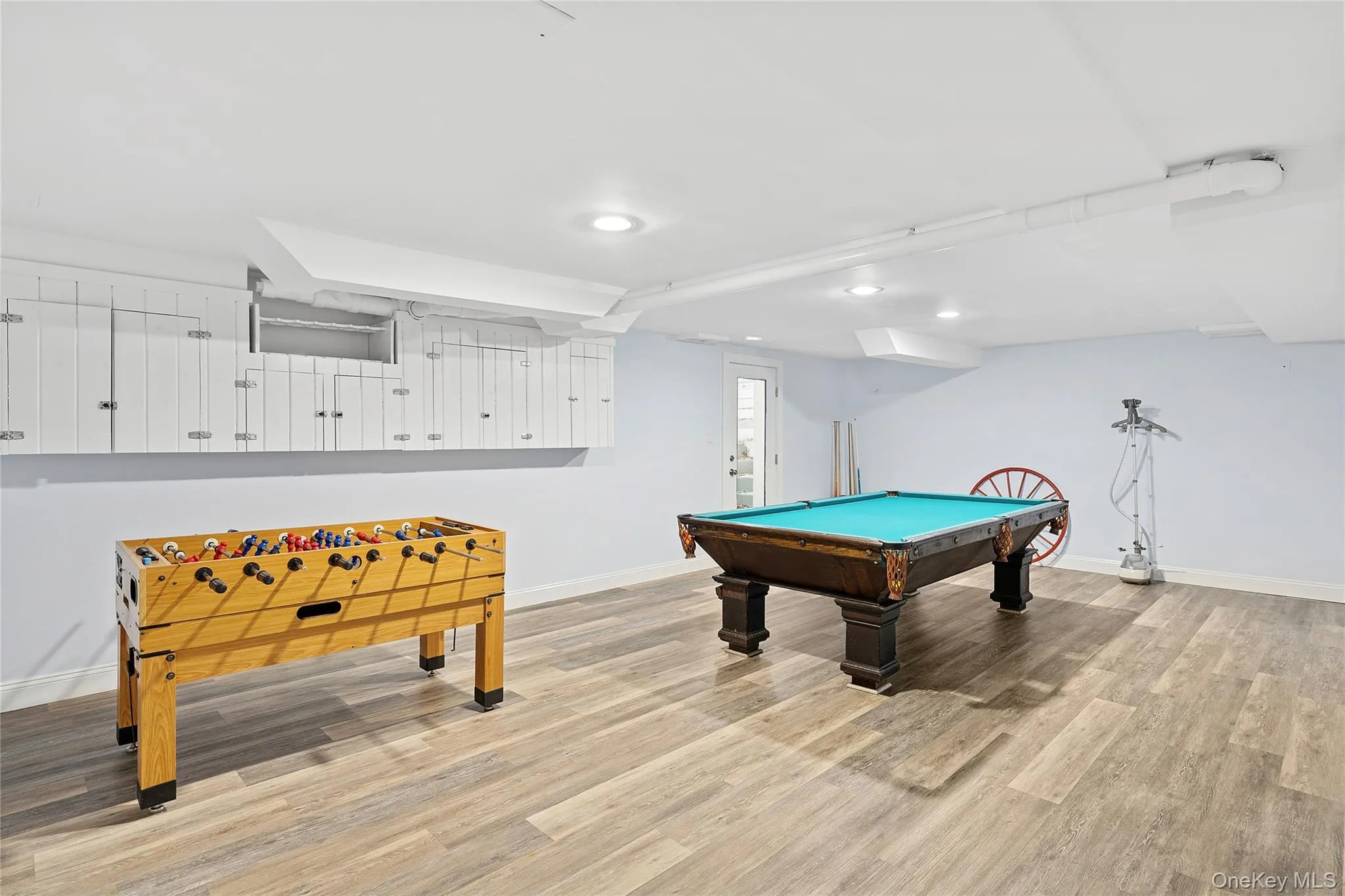 Playroom featuring billiards and light wood finished floors