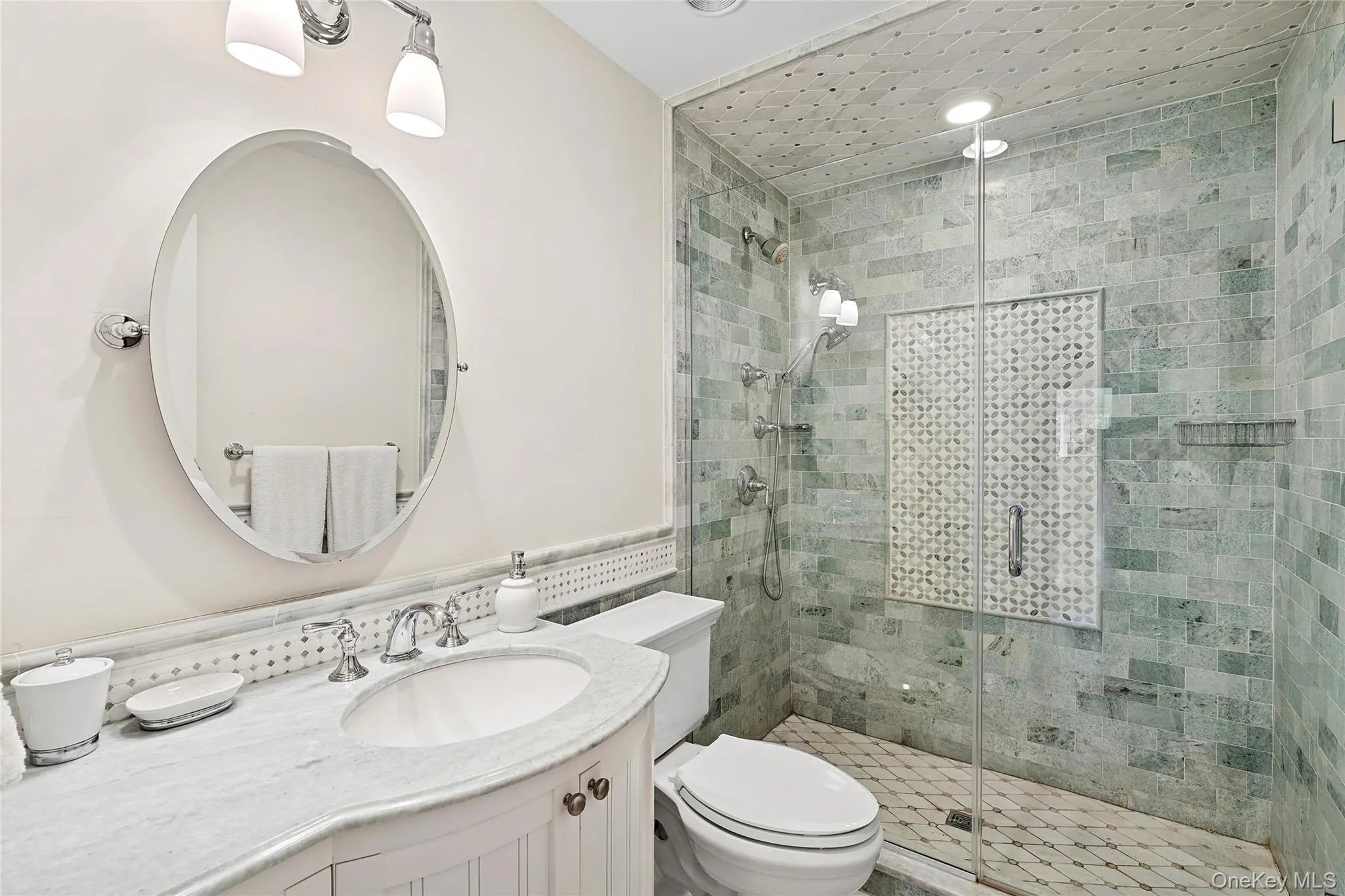 Full bath featuring vanity and a stall shower