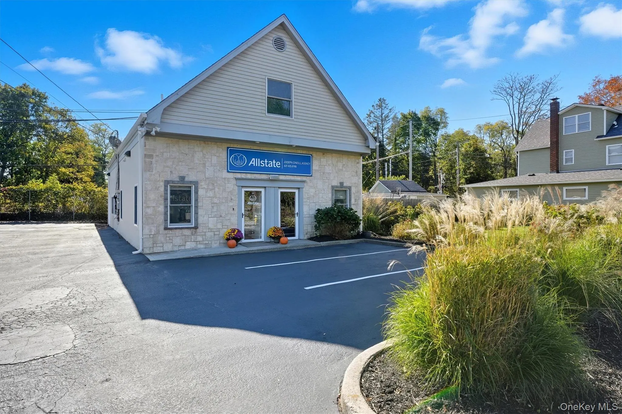 View of property with uncovered parking View of property with uncovered parking